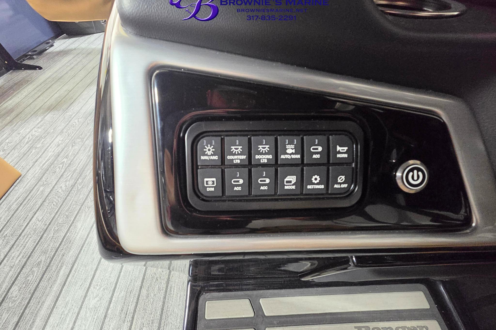 Control panel of a 2026 Ranger 220F boat with various function buttons.
