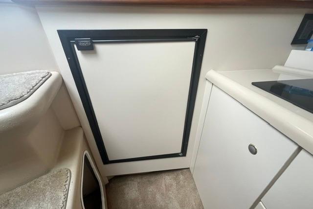 Interior view of 2004 Cruisers Yachts 3372 Express, featuring a compact kitchenette area.