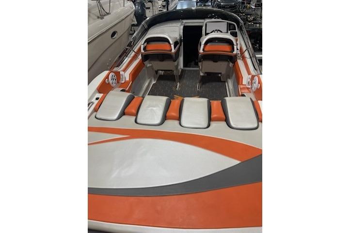 2007 Formula 382 FASTech boat with orange and white seating, showcasing sleek design.