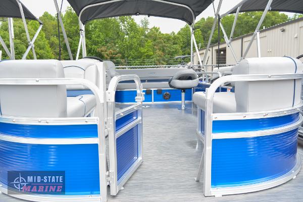 2024 Lowe Ultra 200 Cruise pontoon boat with blue and white seating, under a canopy.