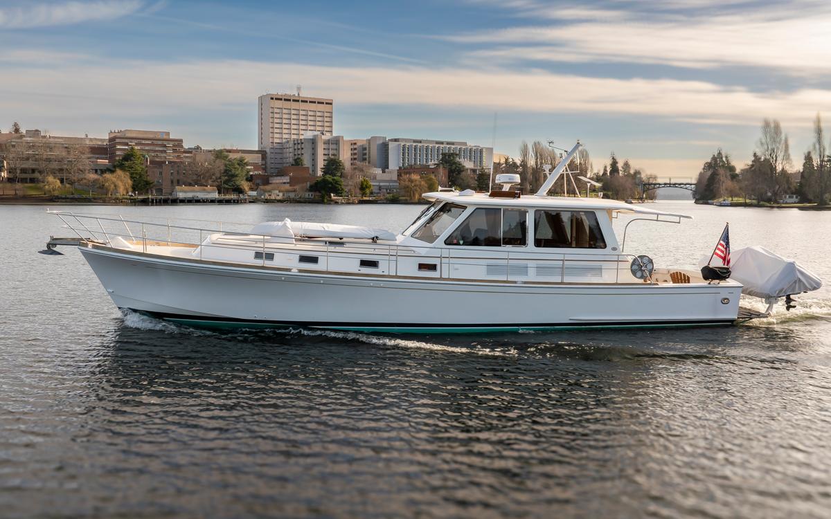 2003 Grand Banks 54 Eastbay SX yacht on calm water.