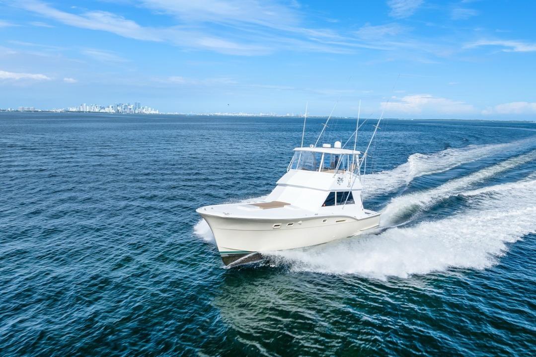 1978 Hatteras 45 Convertible yacht cruising on open blue water.