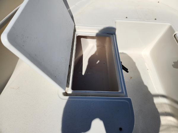 Open storage compartment on 2023 May-Craft 208 CC boat.