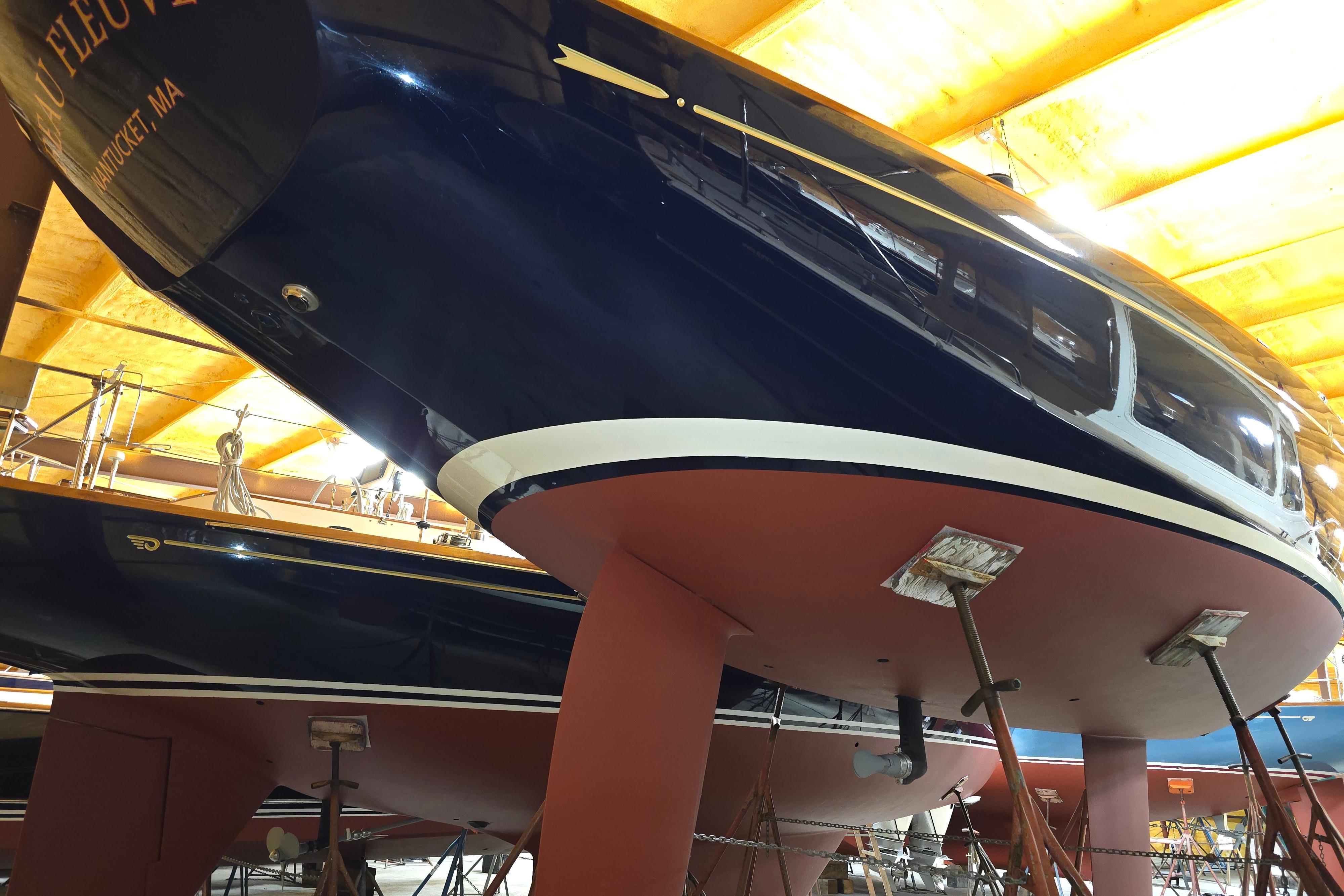 2016 Morris M36 yacht in dry dock, showcasing sleek hull design and craftsmanship.