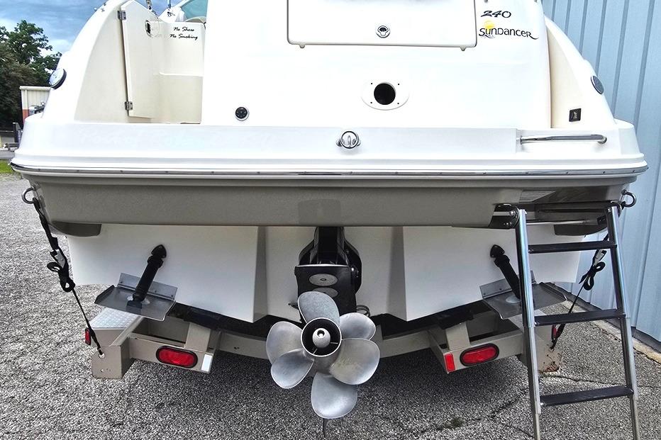 Rear view of a 2006 Sea Ray 240 Sundancer boat with propeller and ladder.