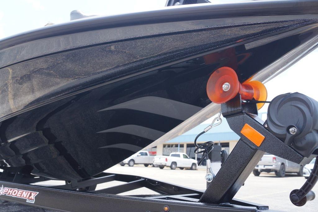 Close-up of 2027 Phoenix 921 Elite X II boat hull on trailer.