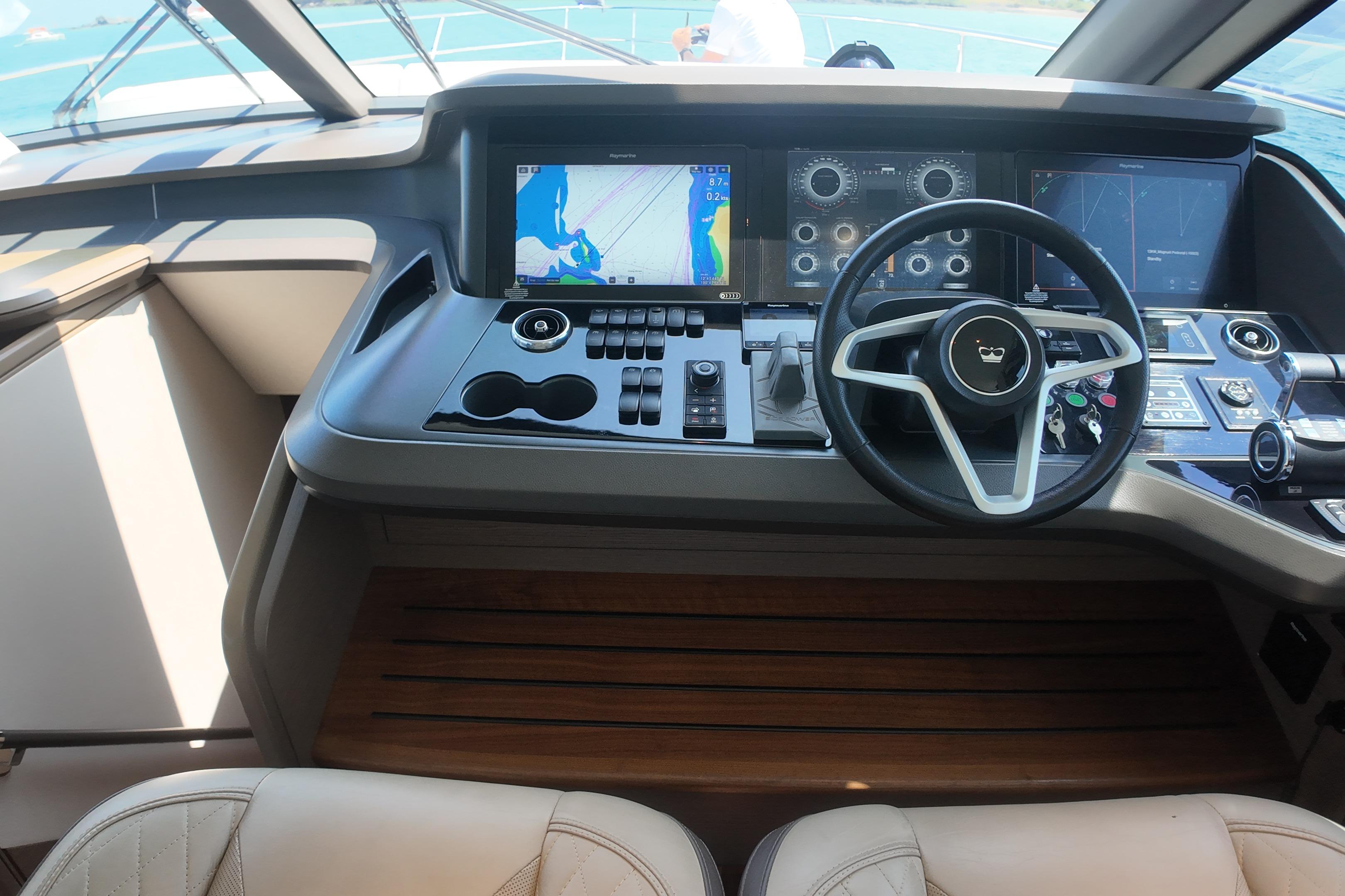 Cockpit of 2023 Princess Y72 yacht with advanced navigation controls and displays.