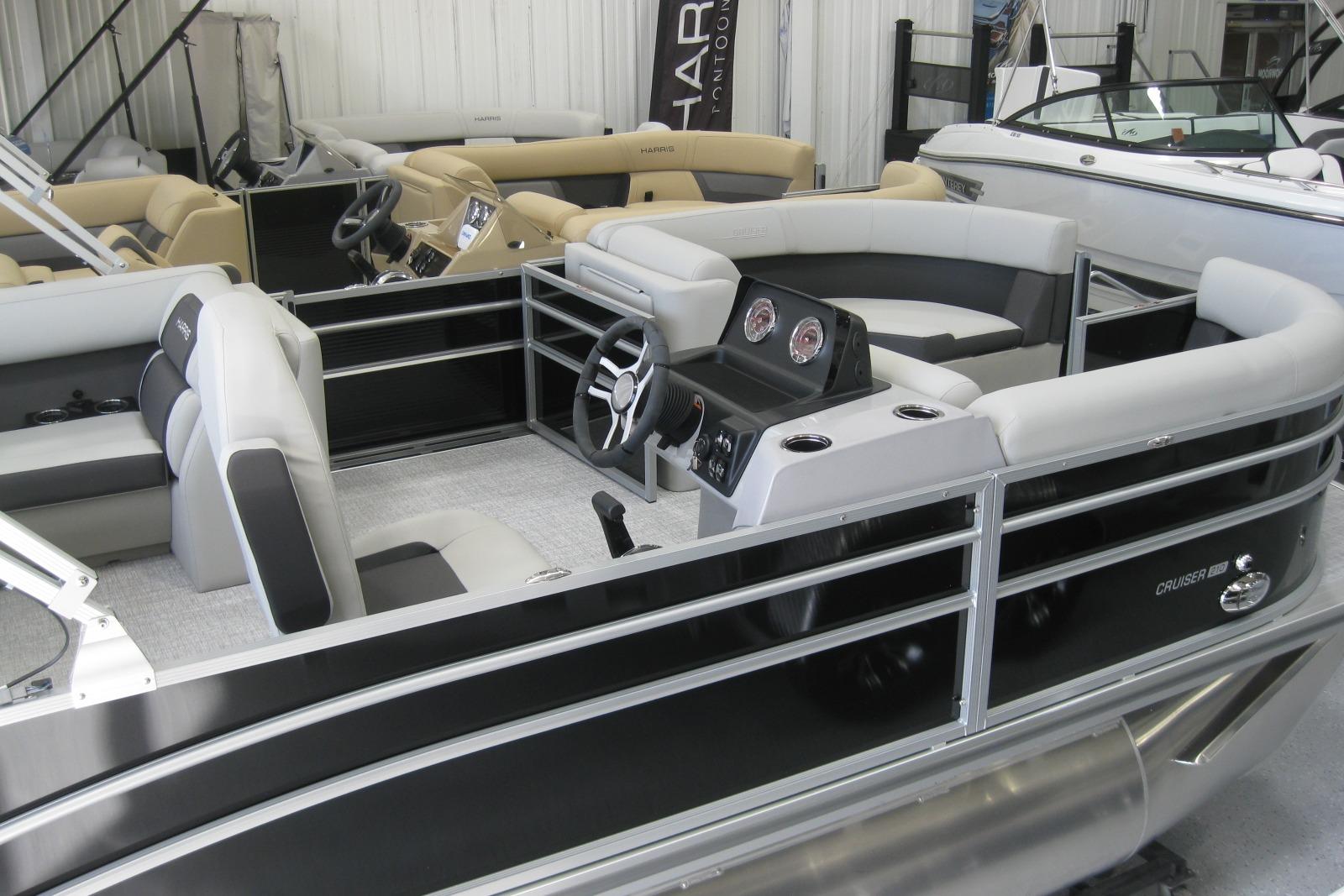 2024 Harris FloteBote Cruiser 210 pontoon boat interior with modern seating and steering console.
