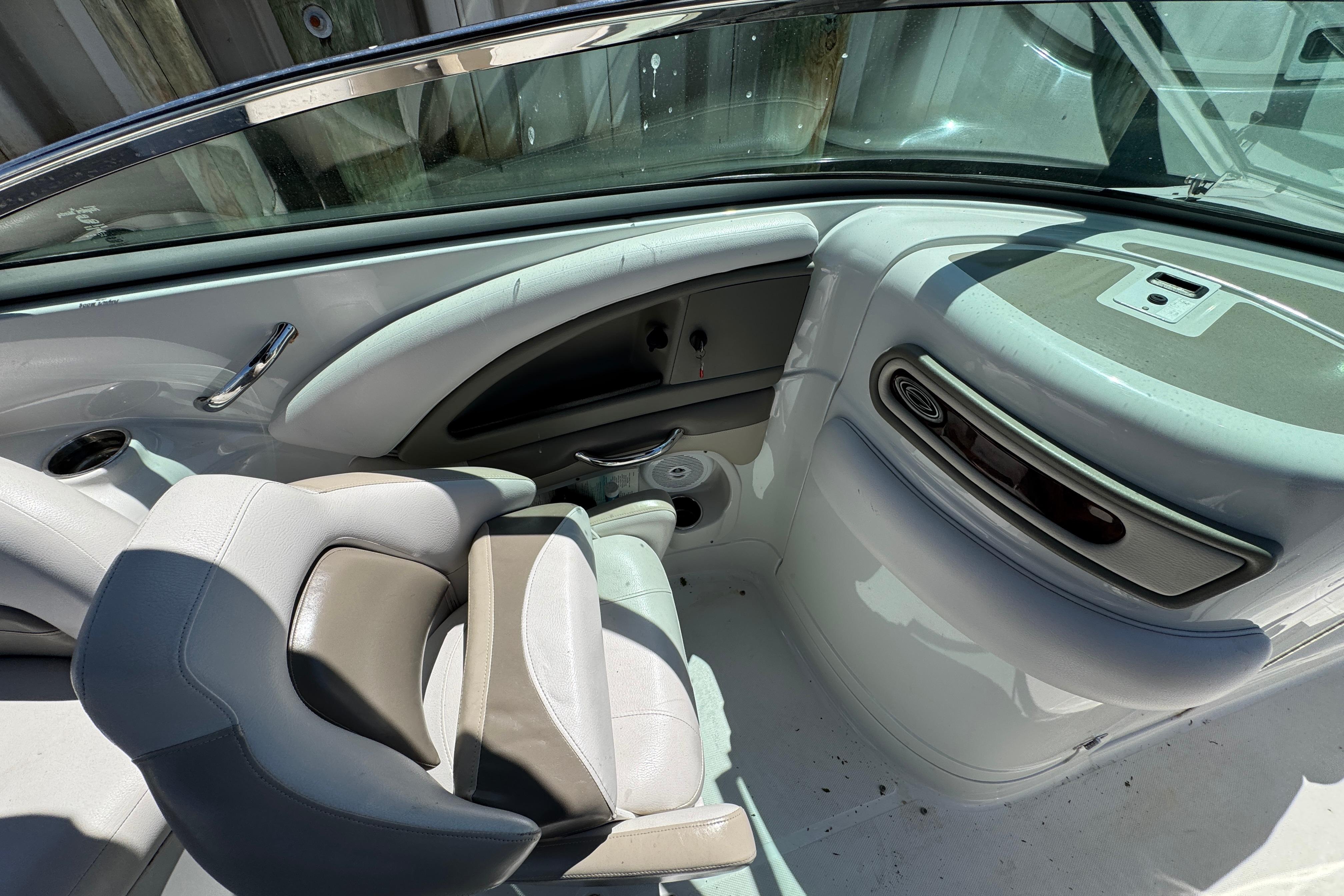 Interior of 2013 Crownline Eclipse E6 XS boat with seating and dashboard details.