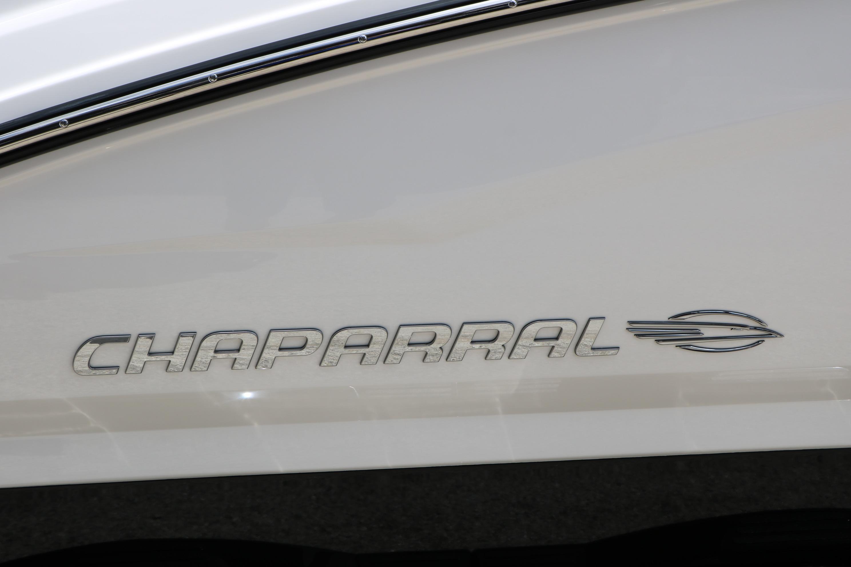 Chaparral 23 SSi 2025 boat logo on sleek white surface.