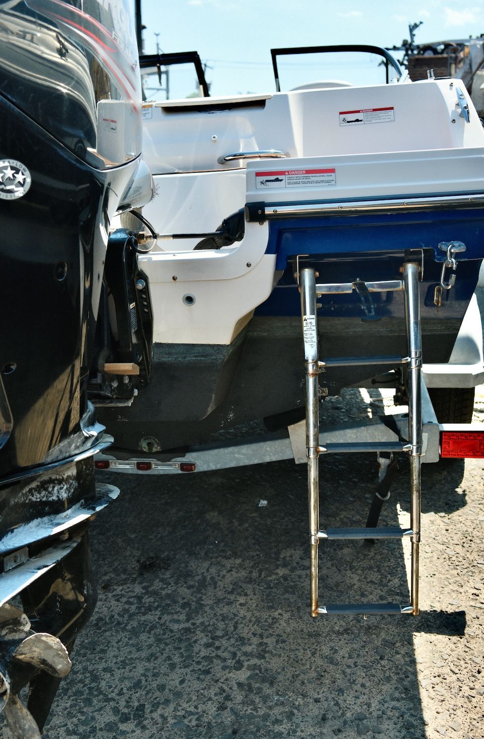Rear view of a Bayliner VR4 Bowrider OB with a swim ladder.