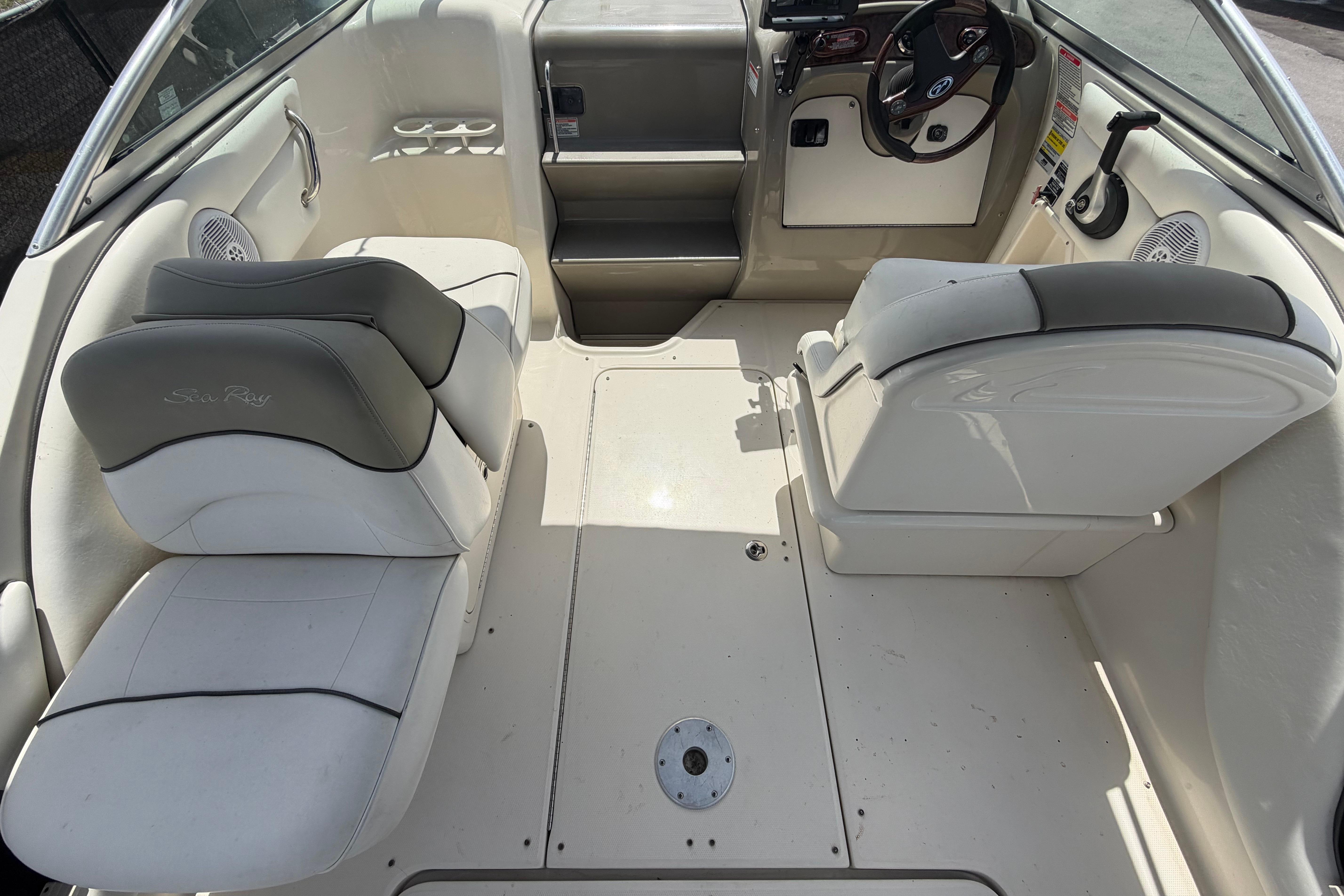 2006 Sea Ray 250 Amberjack boat interior with seating and steering wheel.