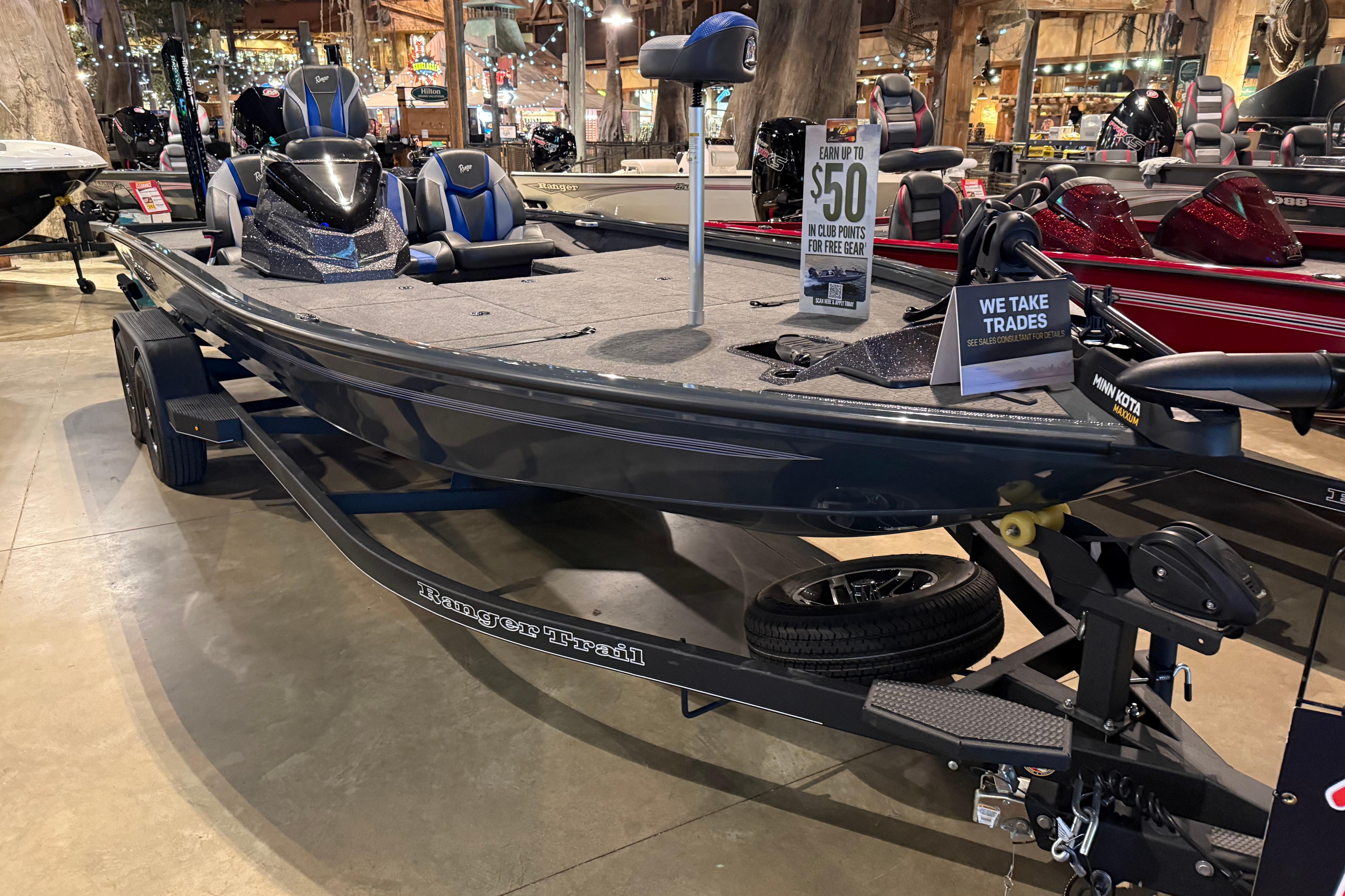 2025 Ranger ALPHA 208 boat on display, featuring sleek design and trade-in options.