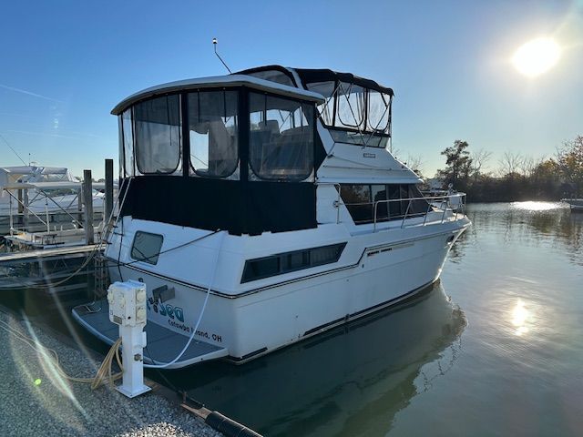 1988 Carver 3807 Aft Cabin Motor Yacht docked at sunset.