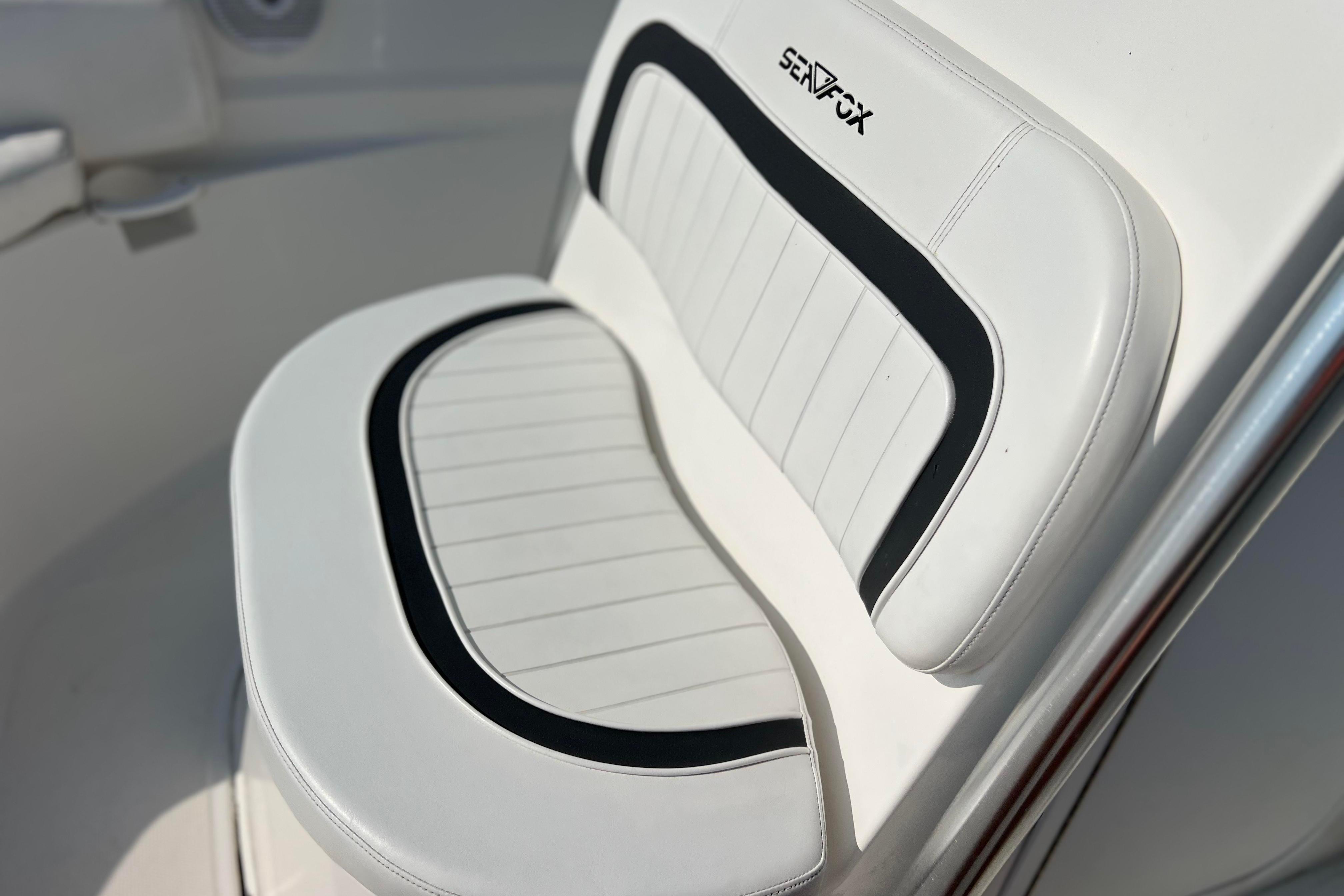 White cushioned seat on 2012 Sea Fox 206 Center Console boat.
