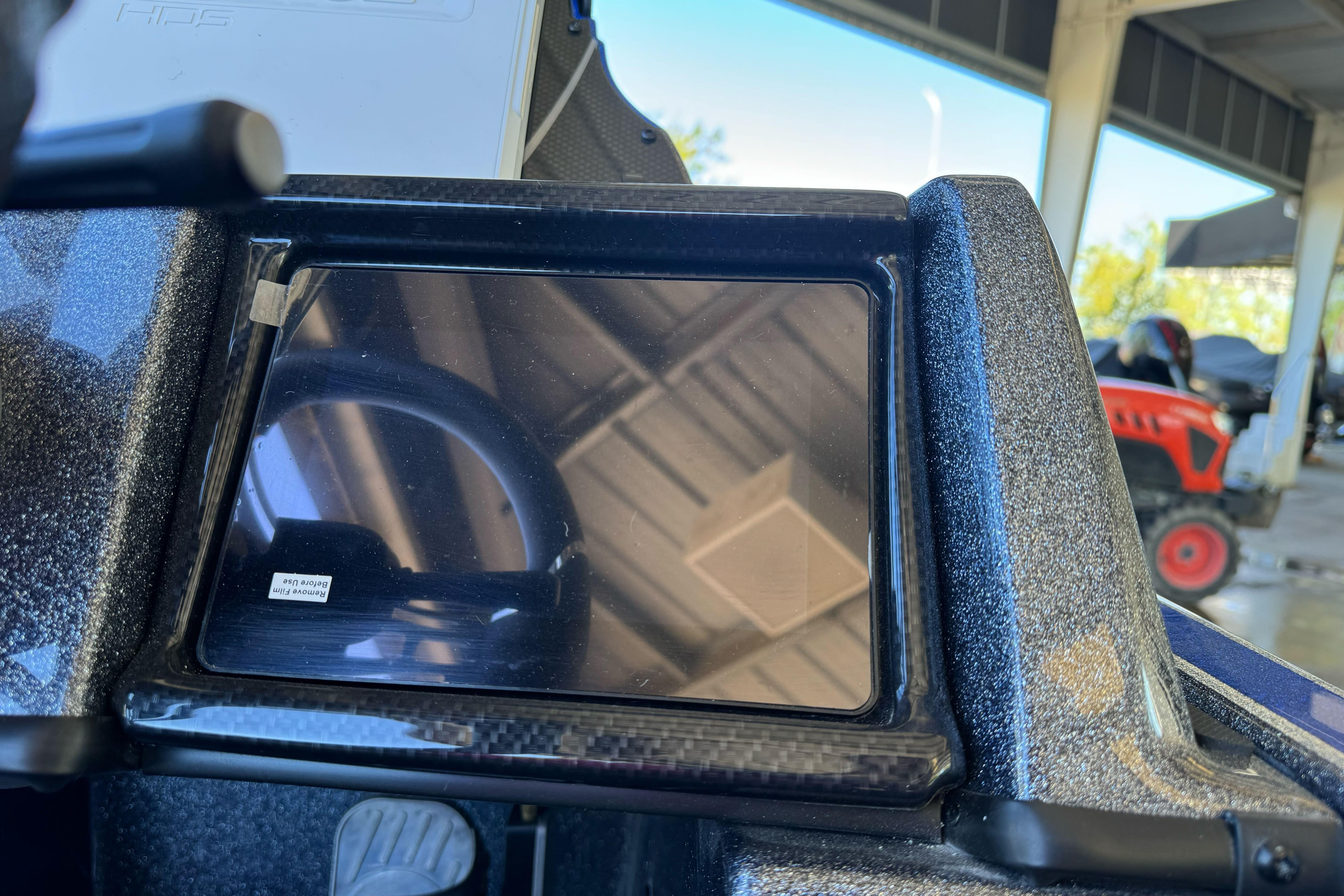Dashboard of a 2026 Triton 21XP Patriot boat with a digital display.