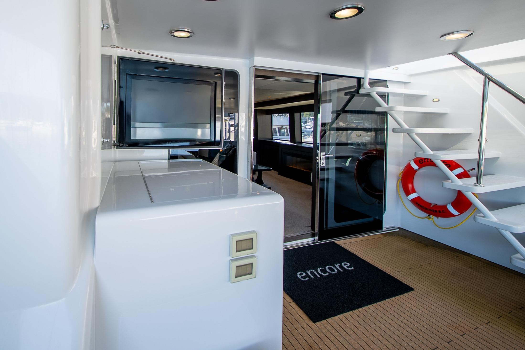 Luxurious 1992 Crescent Custom yacht interior with modern design, featuring stairs and a lifebuoy.