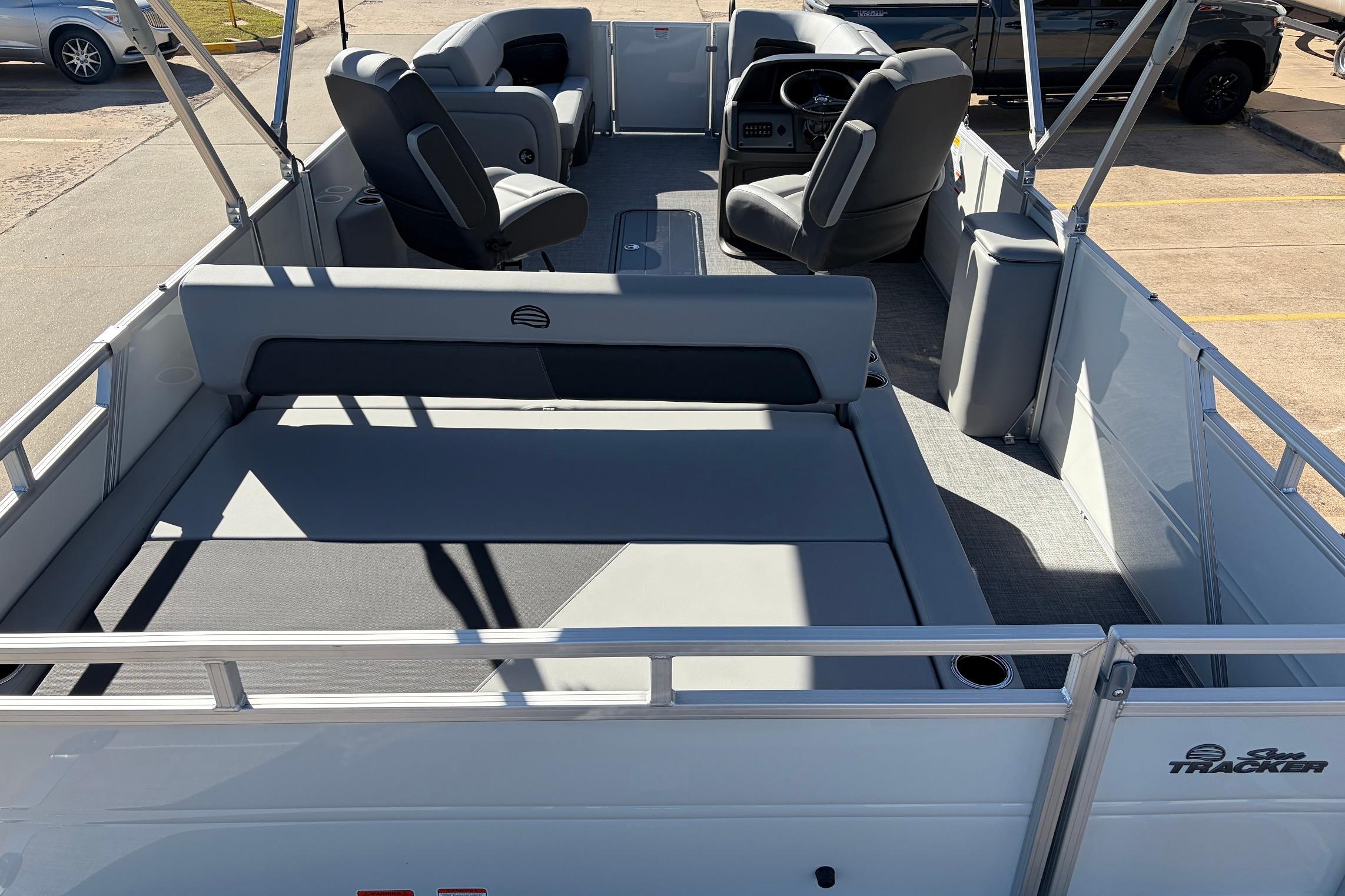 2026 Sun Tracker Party Barge 22 RF XP3 interior with seating and steering console.