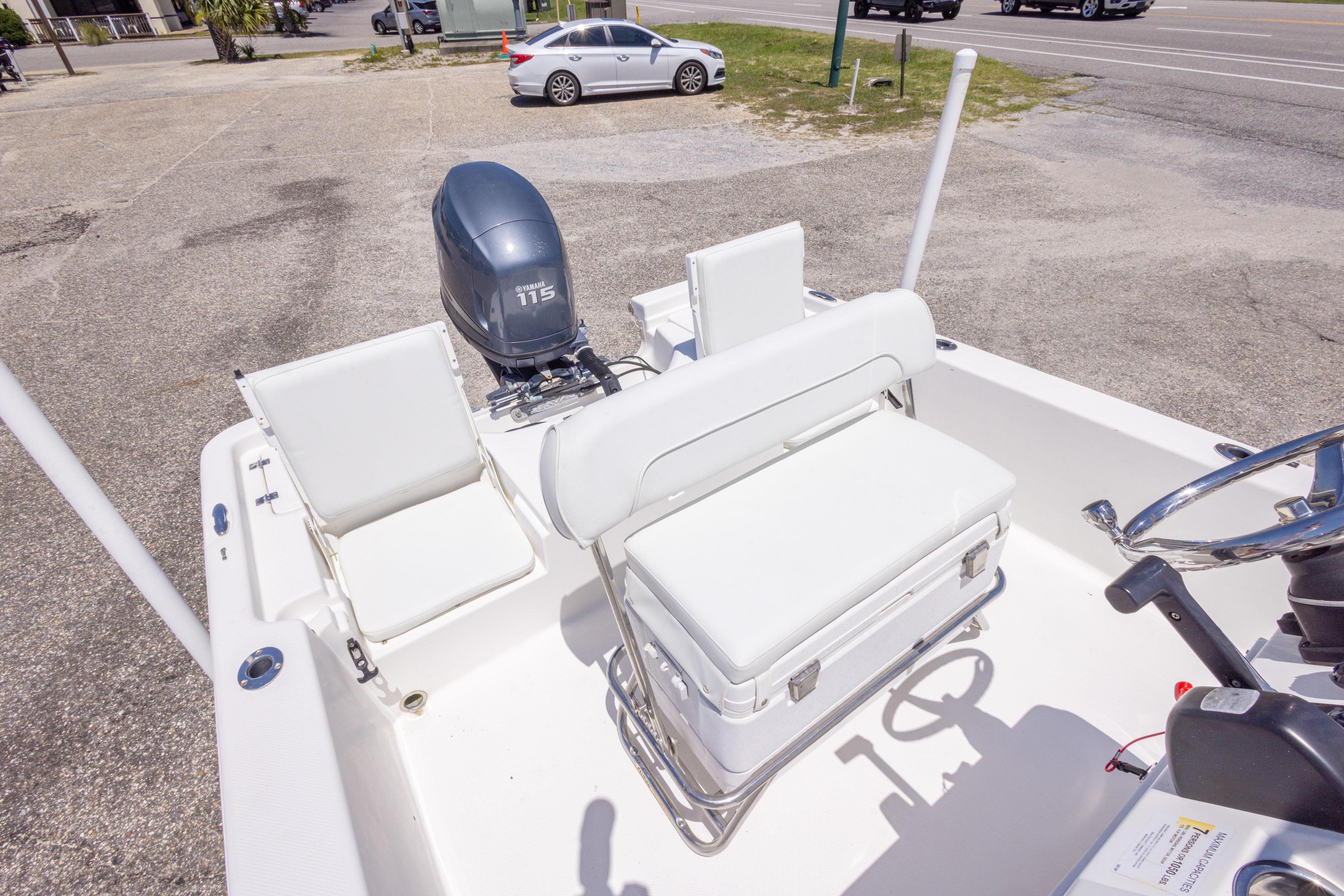 2011 Sea Fox 200XT boat interior with Yamaha 115 engine, white seating, and steering wheel.