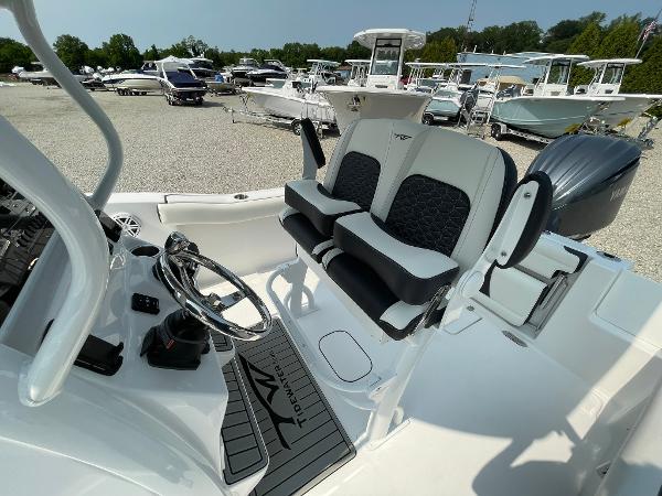 2025 Tidewater 232 CC Adventure boat interior with dual seats and steering wheel.