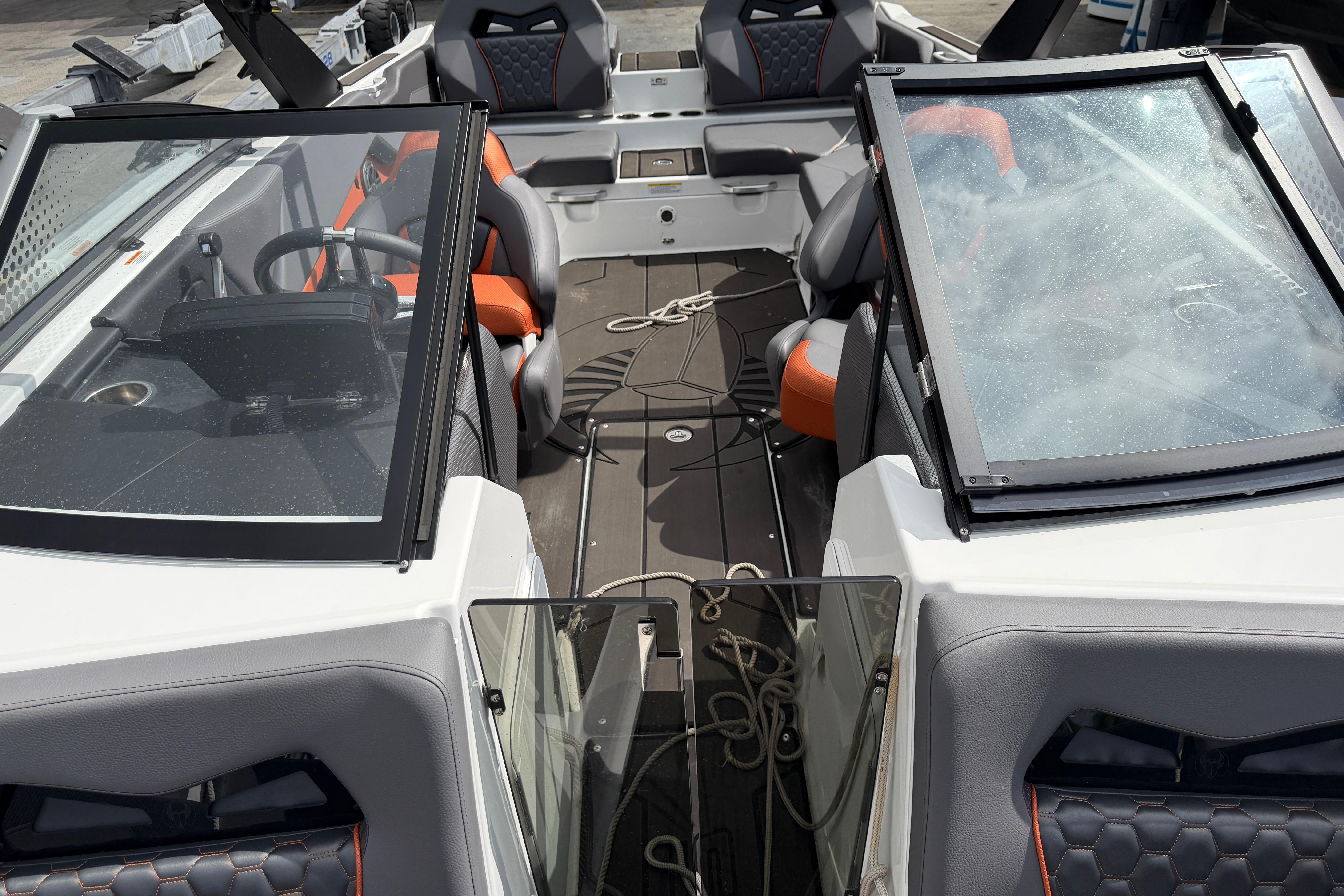2026 Scarab 235 LX boat interior with modern seating and dashboard design.