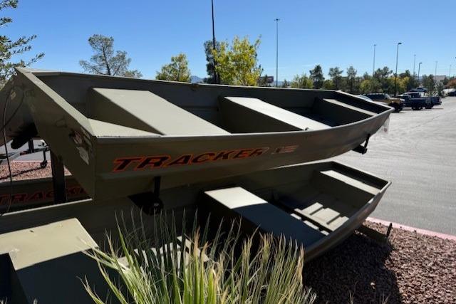 2026 Tracker Grizzly 12 Jon boat displayed outdoors in a parking lot.