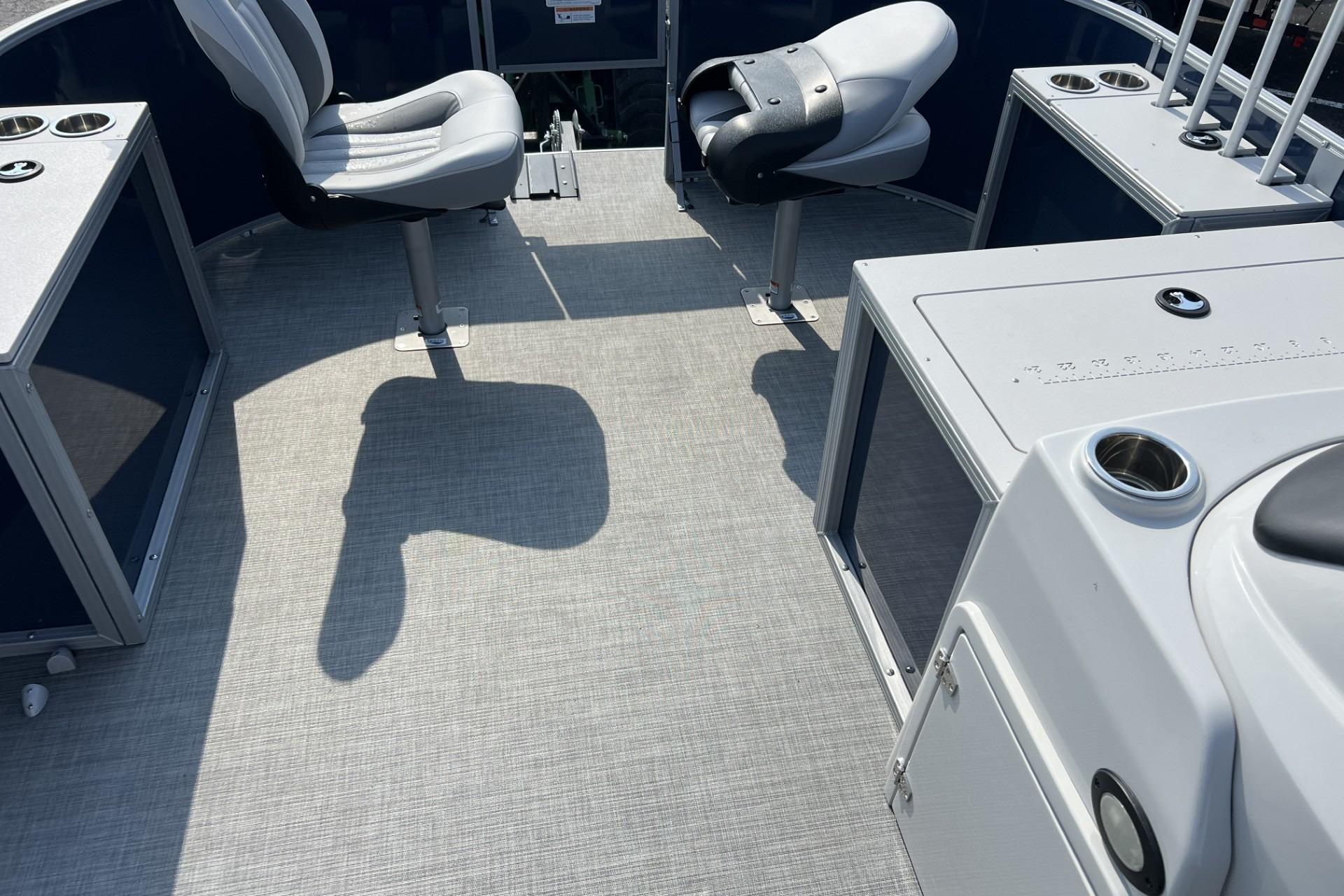 2024 Lowe SF 214 Sport Fish boat interior with seating and fishing rod holders.