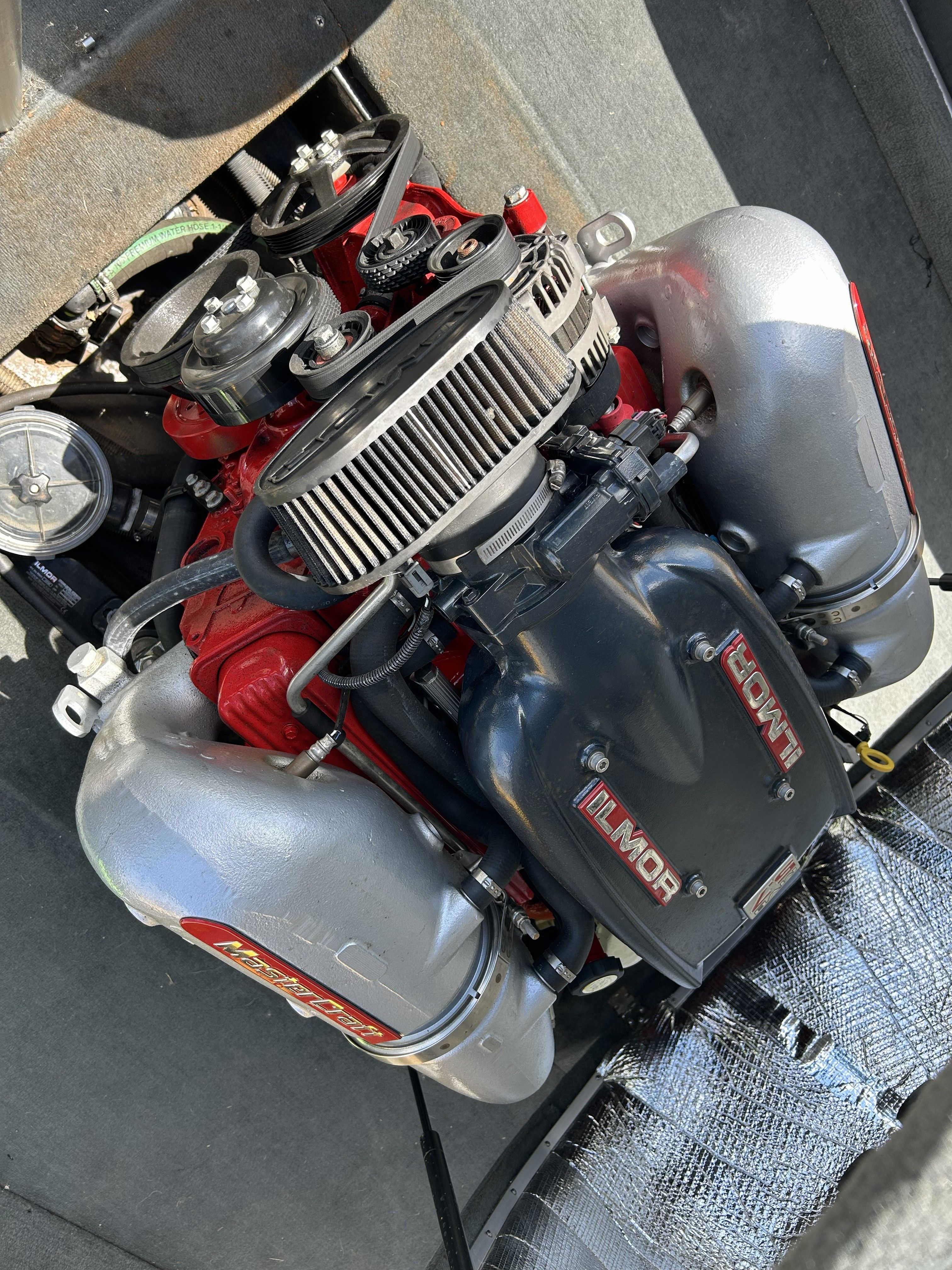 2011 MasterCraft PS197 engine with Ilmor branding, close-up view.