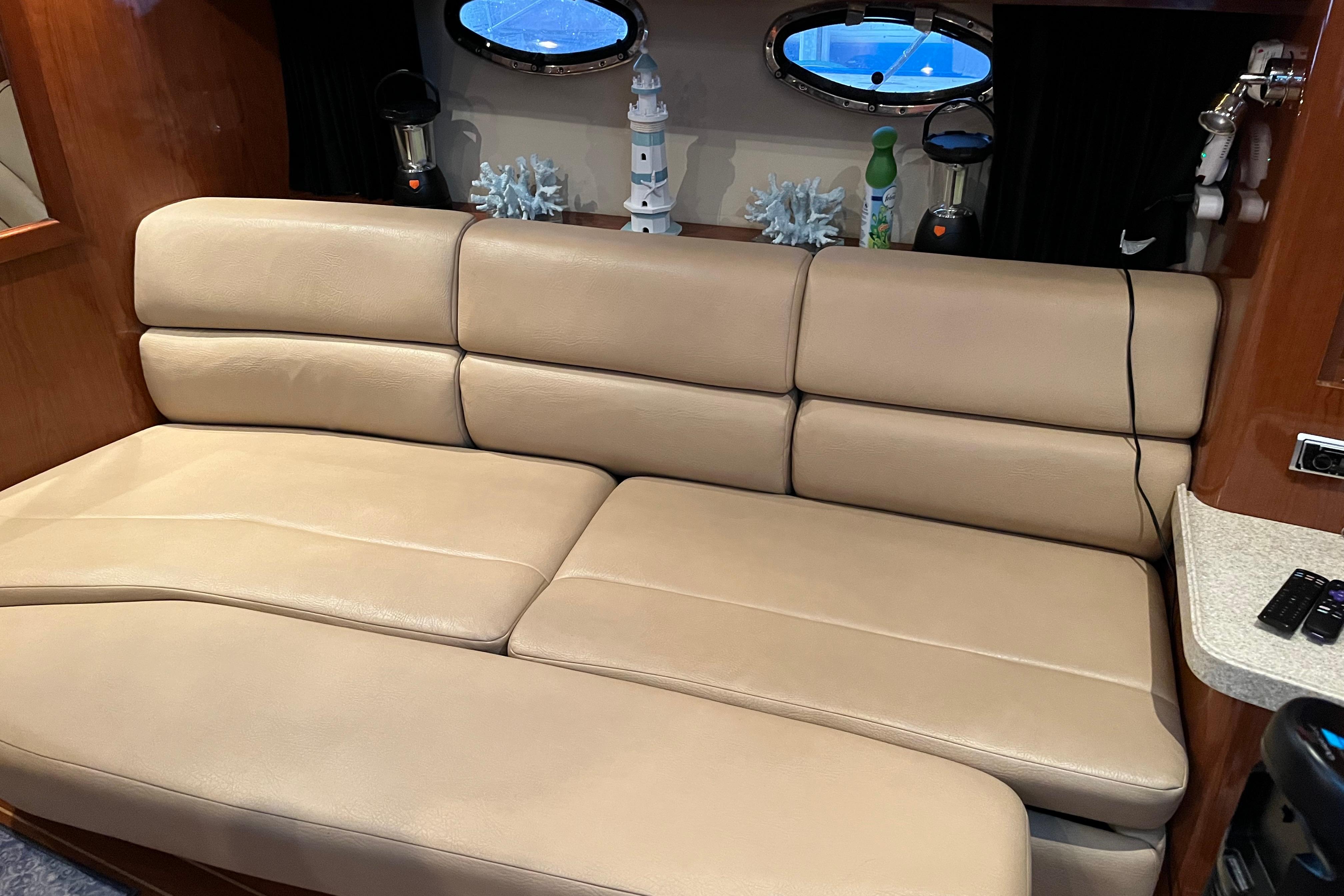 Luxurious beige leather seating in 2007 Regal 3760 IB Commodore yacht interior.