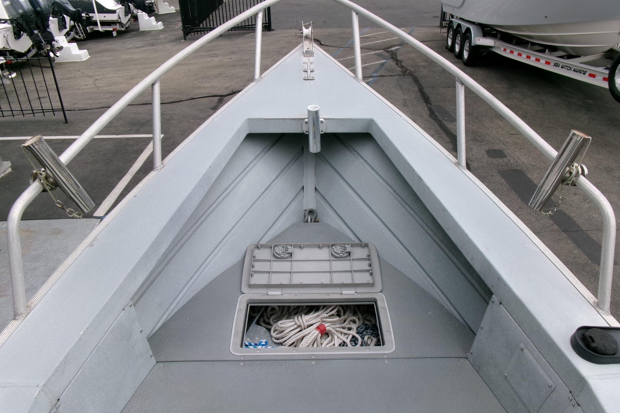 2017 Klamath Bayrunner 19 Baja boat deck with open storage compartment.