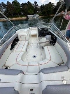 Interior view of a 2008 Yamaha AR230 boat on a lake.