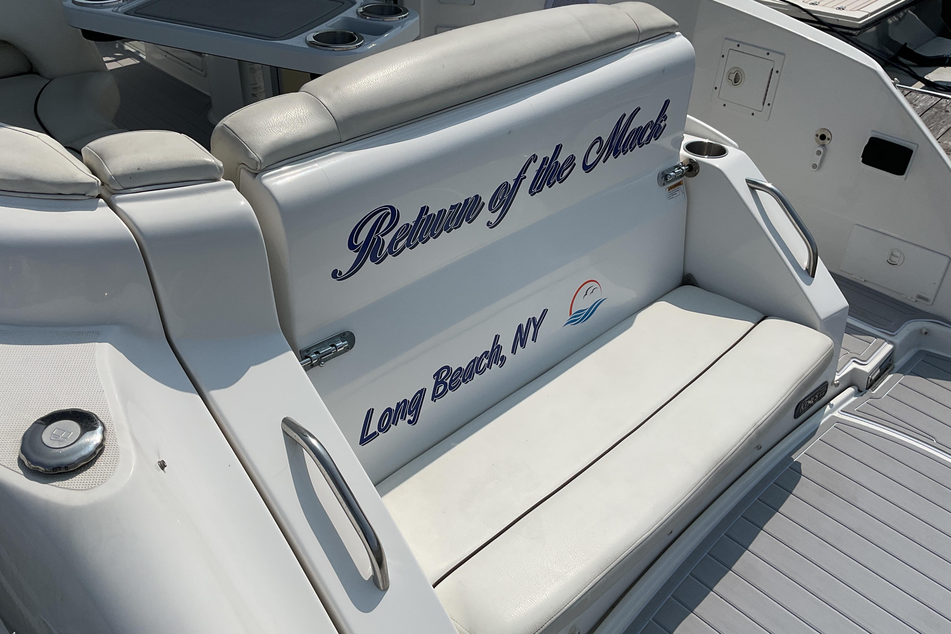 2013 Rinker 290 Express Cruiser boat seat with "Return of the Mack" text, Long Beach, NY.