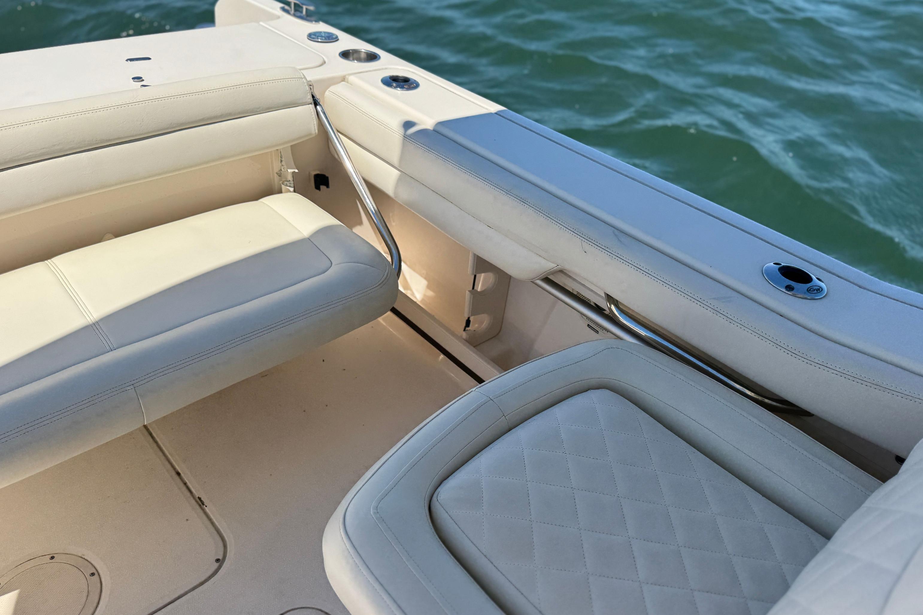 2017 Grady-White Freedom 235 boat interior with cushioned seating and ocean view.