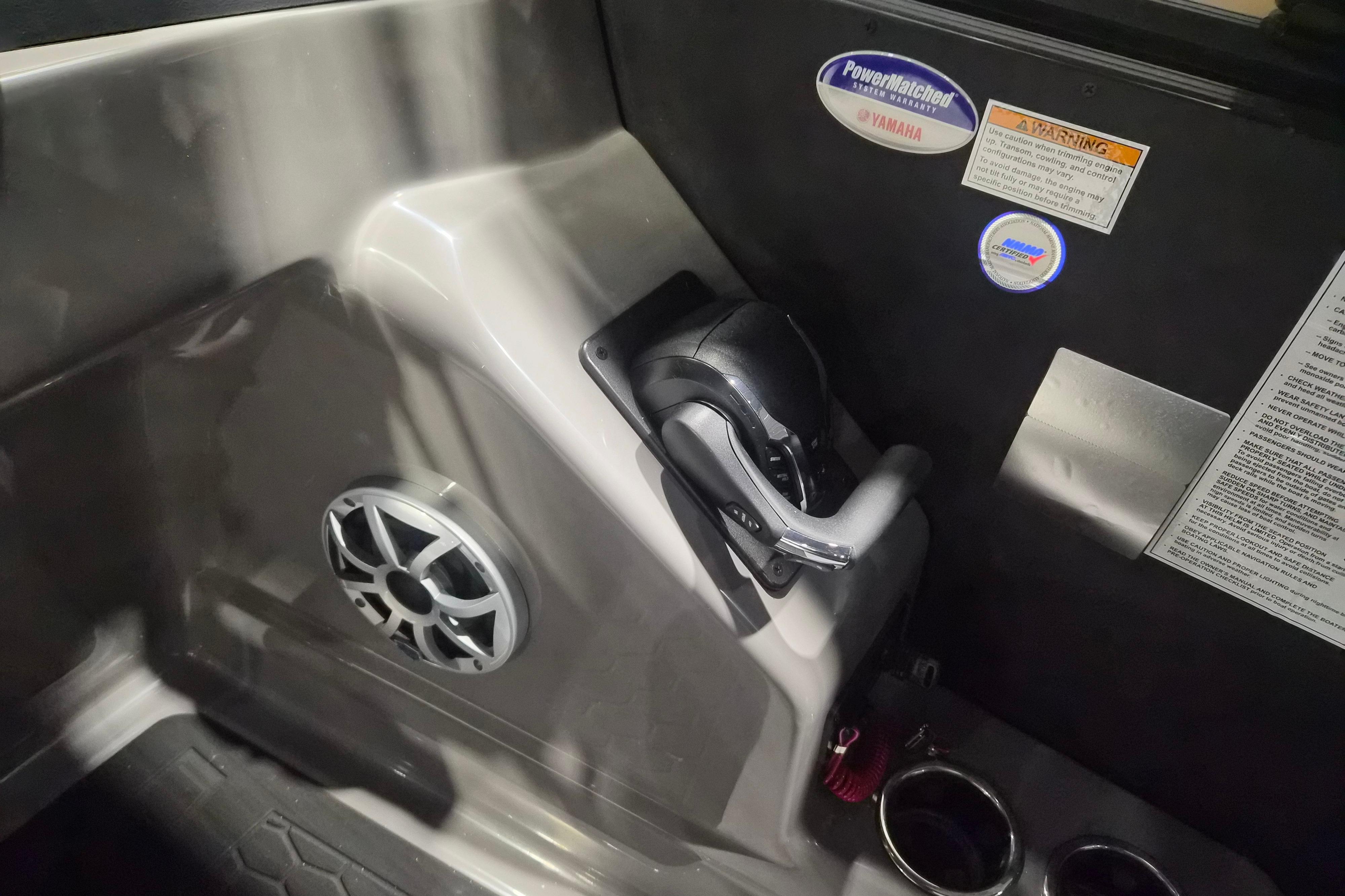 Interior of 2026 Sylvan L3 ULZ boat featuring control panel and speaker system.