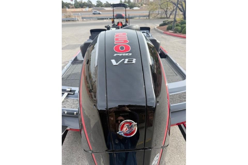 2026 Nitro Z21 XL boat with 250 Pro V8 engine, parked outdoors.