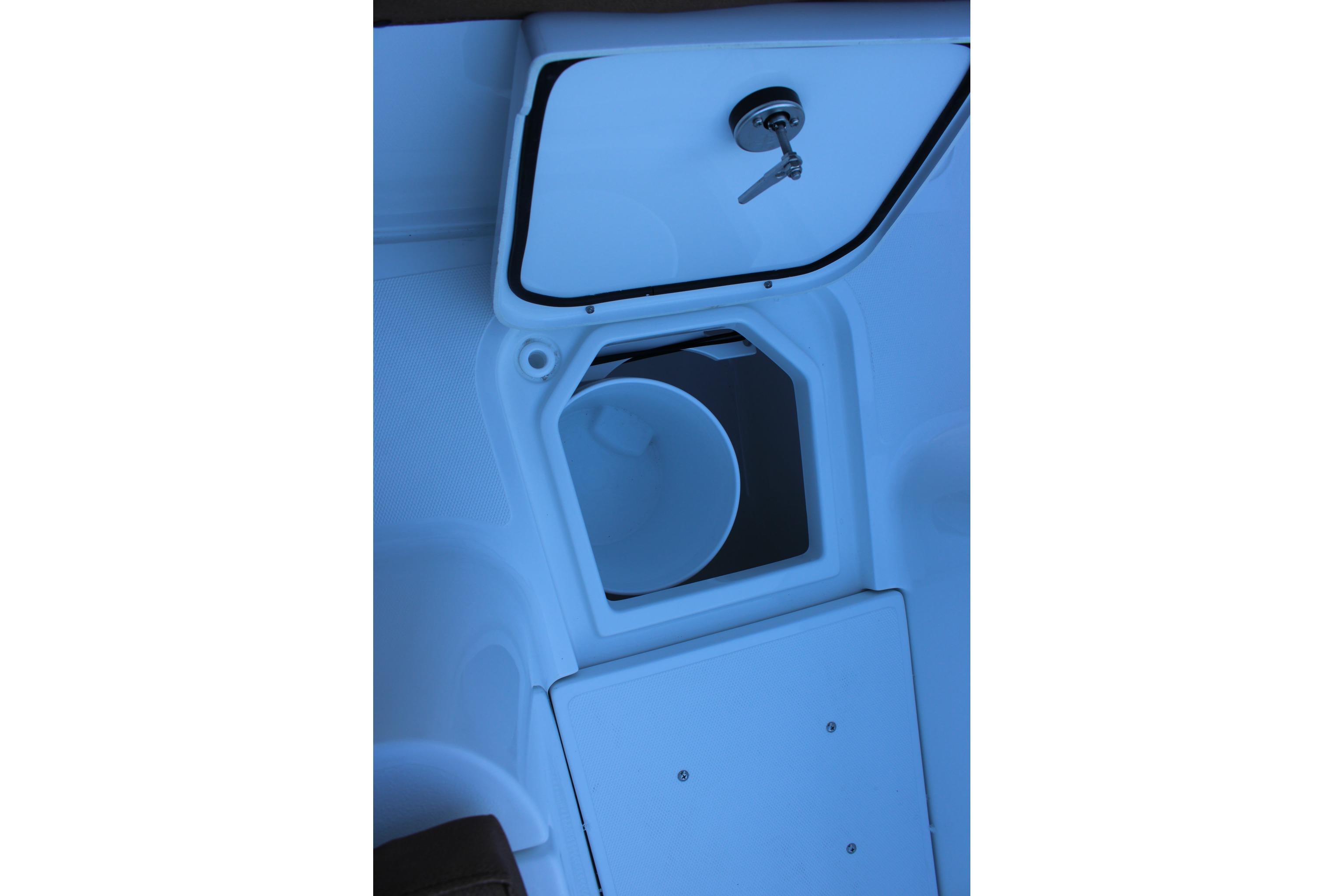 2026 Sea Hunt Gamefish 25 boat storage compartment with open hatch and key.