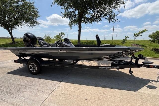 2026 Ranger RT188 boat on trailer, parked outdoors under a clear sky.