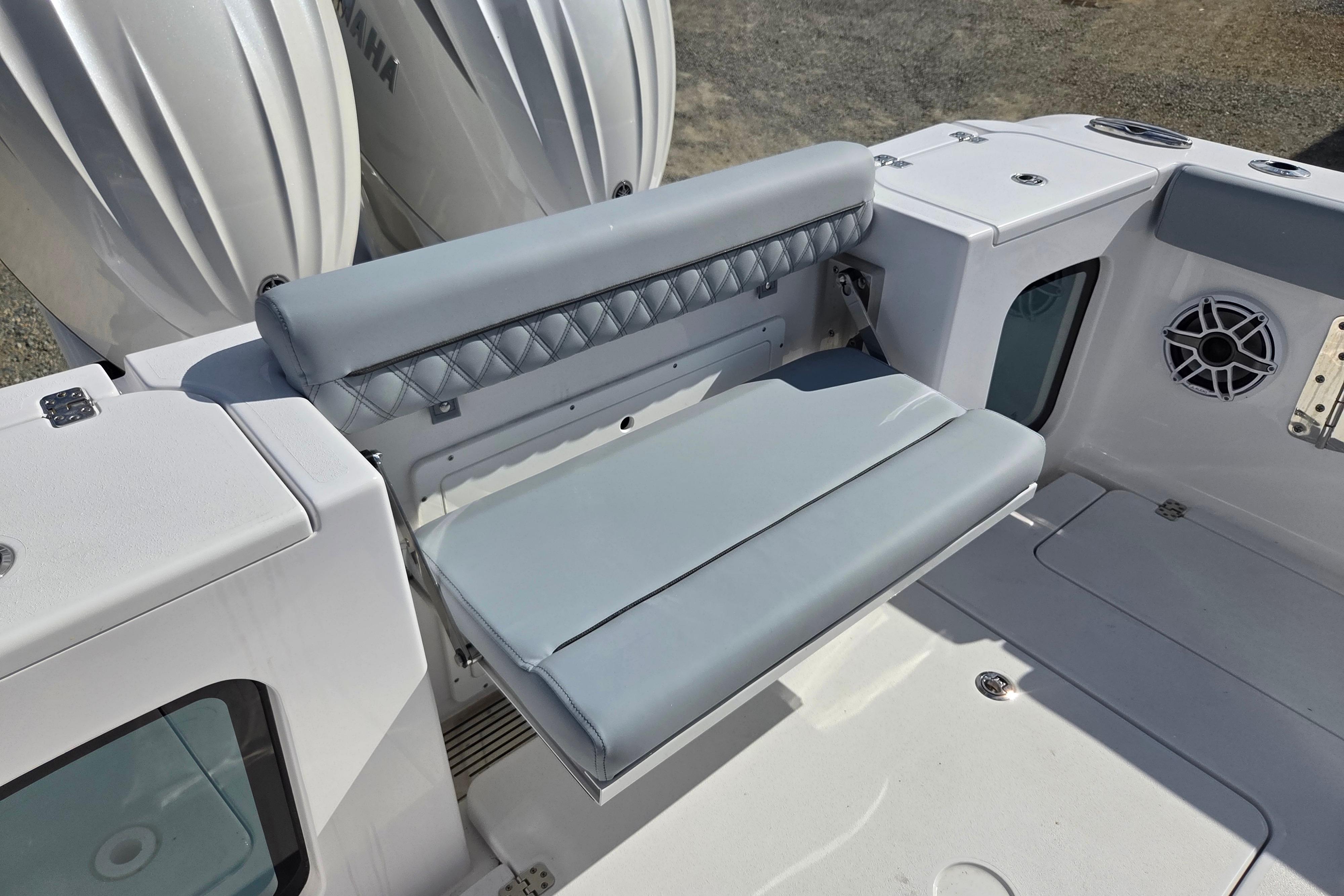 2026 Sportsman Open 282 Center Console boat seating area with Yamaha engines.