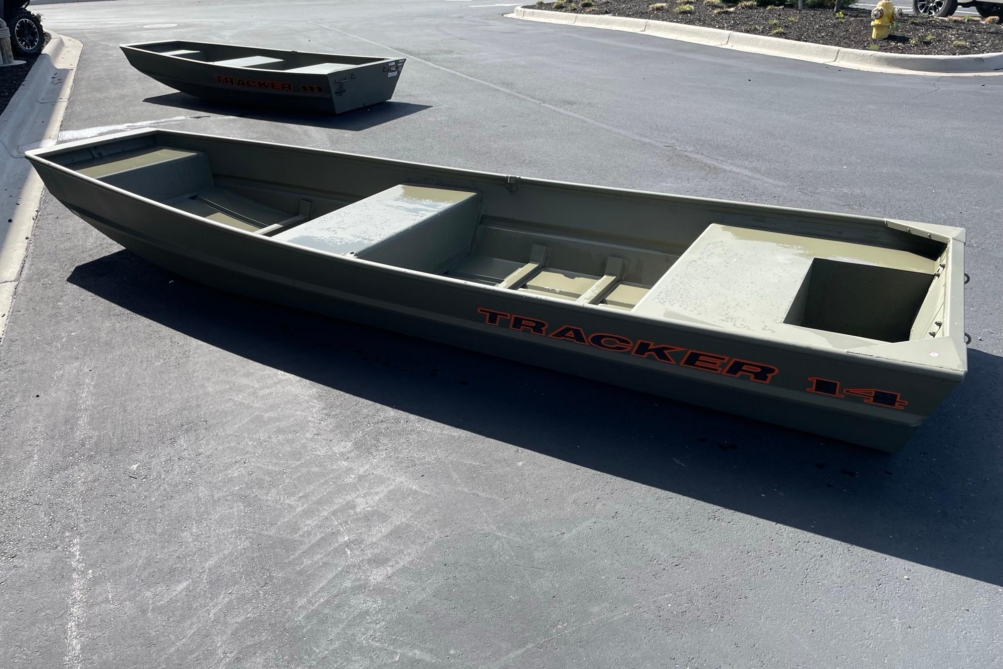 2026 Tracker Grizzly 14 Jon boat on pavement, showcasing its sturdy design.