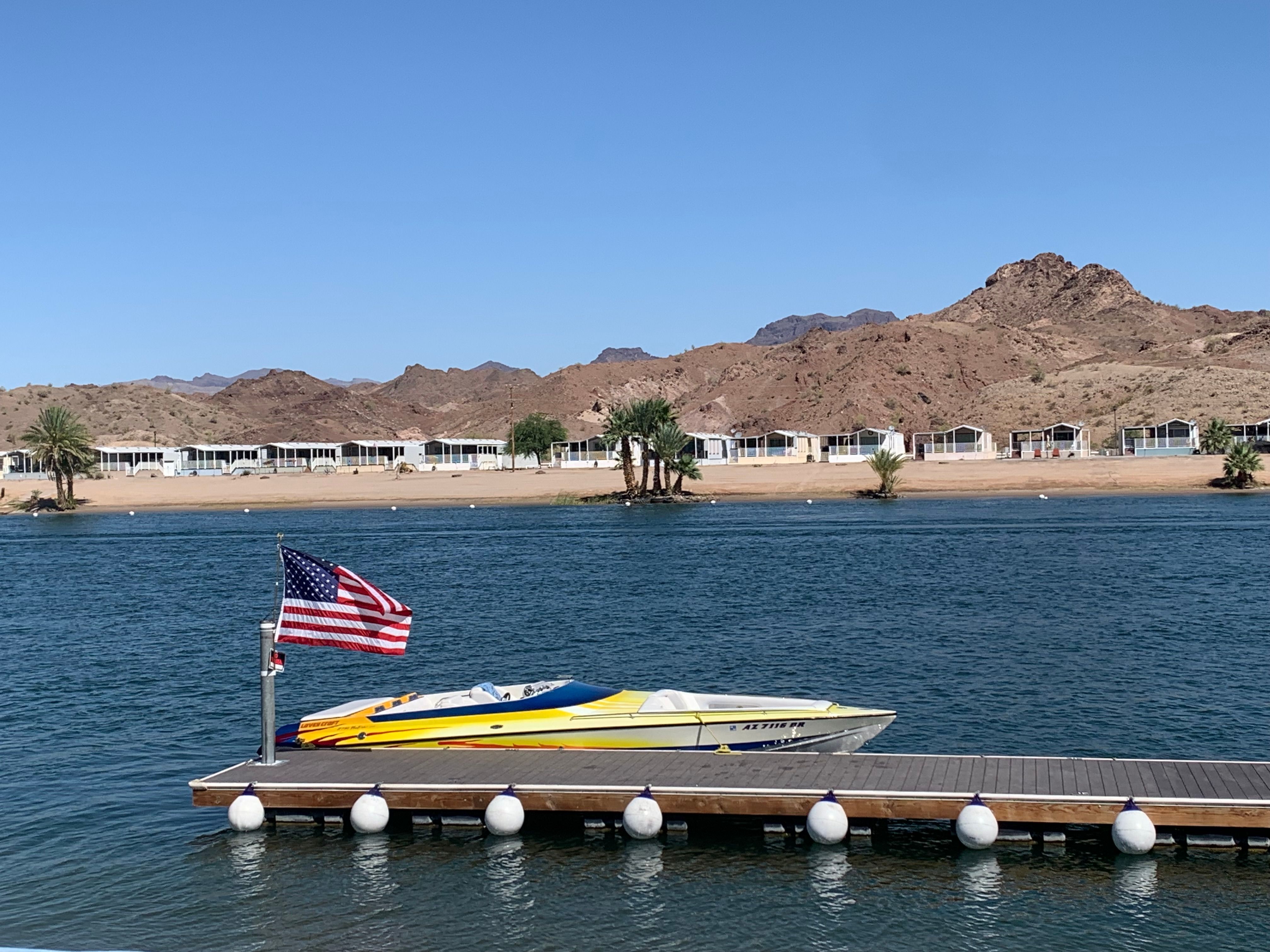 Lavey Craft 2750 NUERA boat docked with American flag.