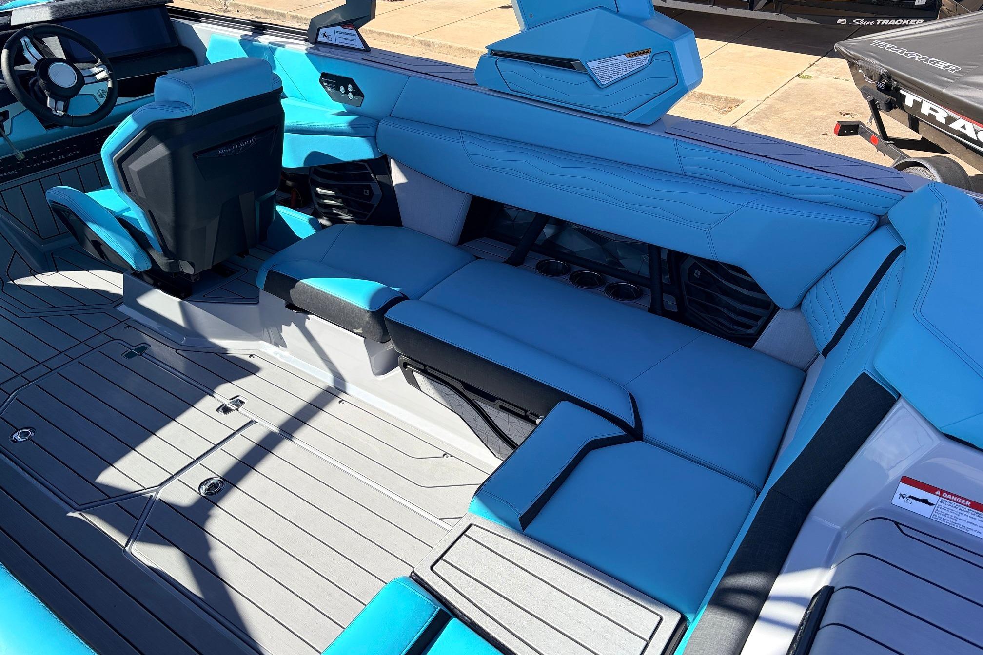 2026 Nautique Super Air Nautique G23 interior with blue seating and modern design.
