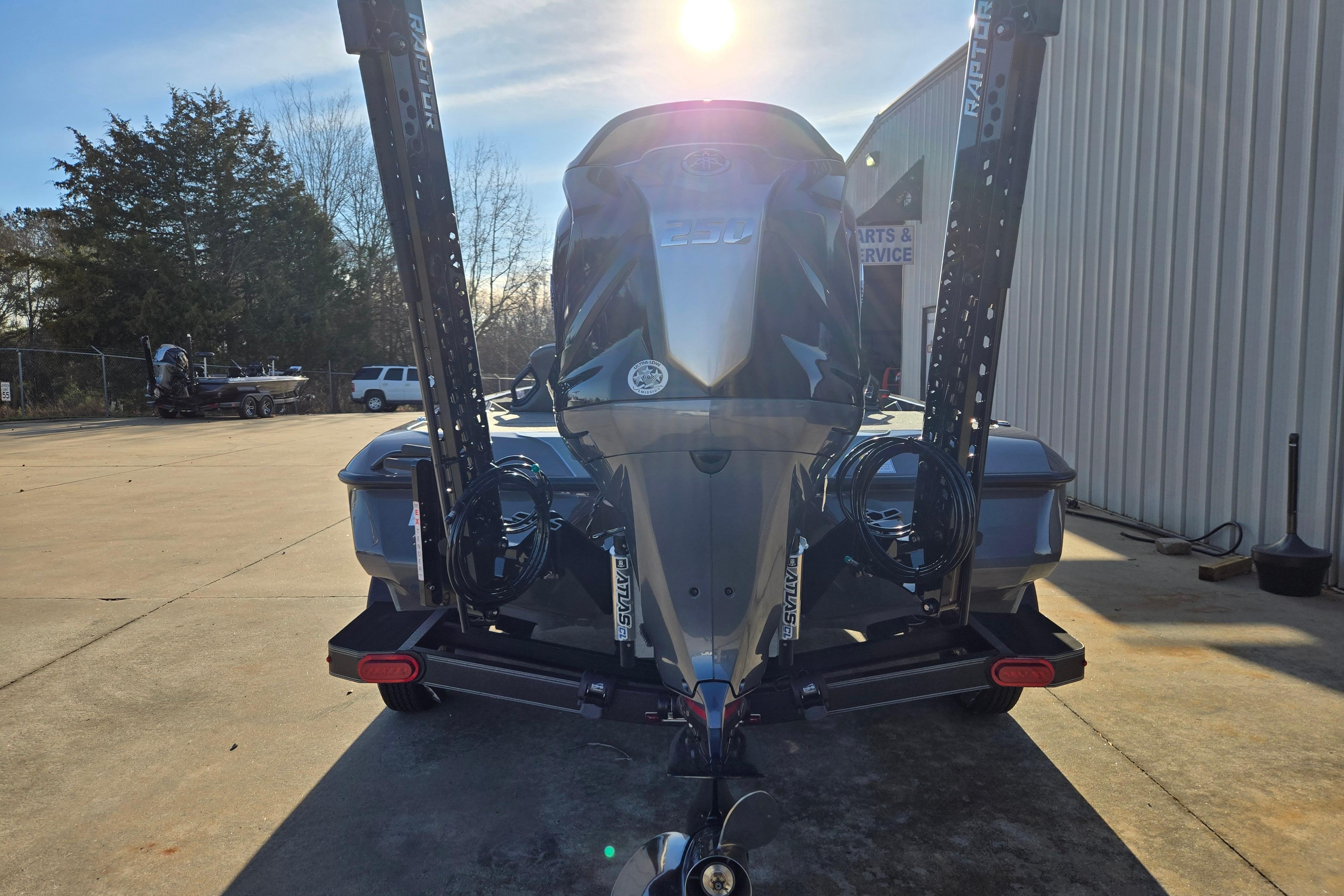 2026 Skeeter ZXE21 boat with powerful engine, parked outdoors in sunlight.