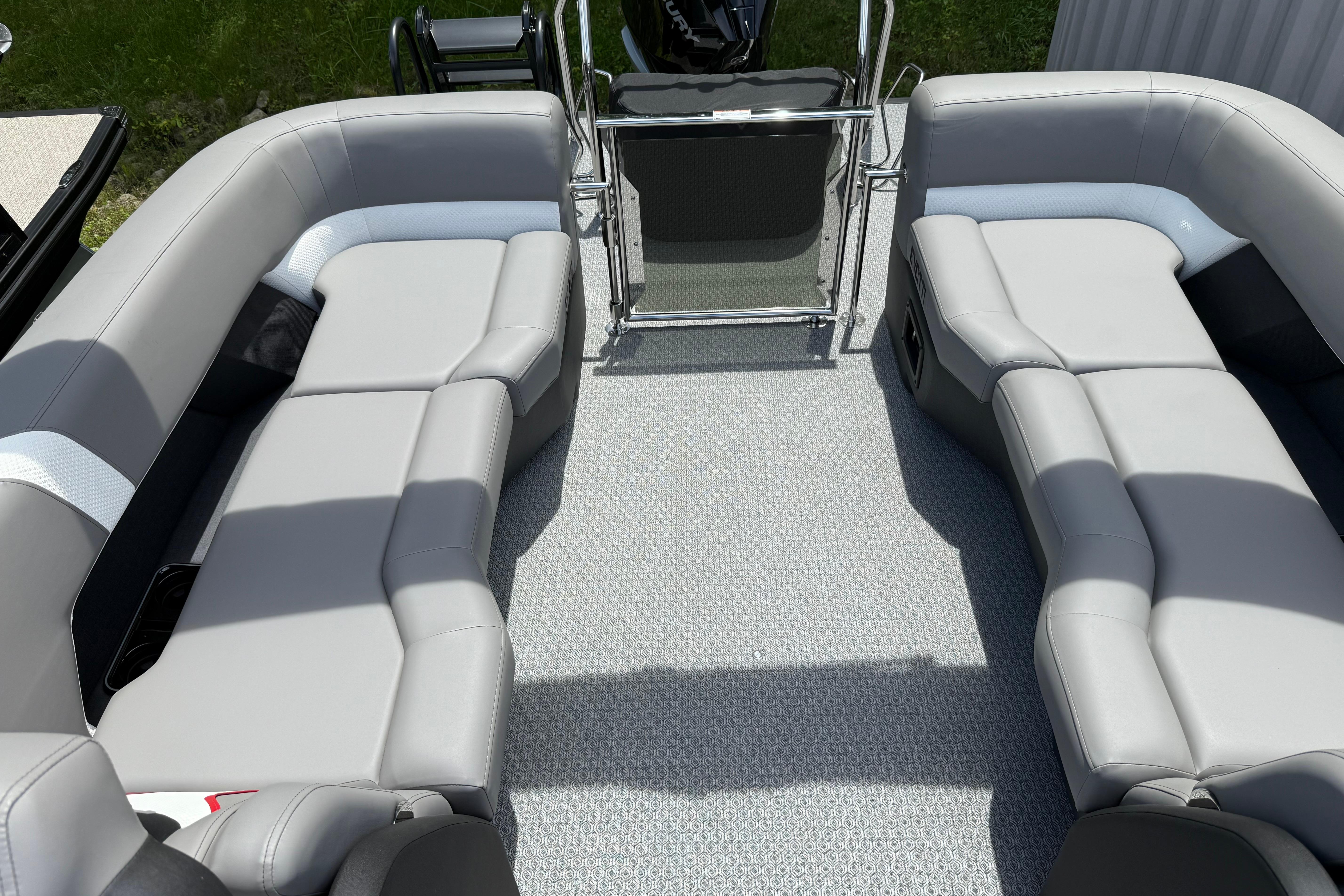 Luxurious seating on 2026 Evotti 723QL boat, featuring sleek gray upholstery.