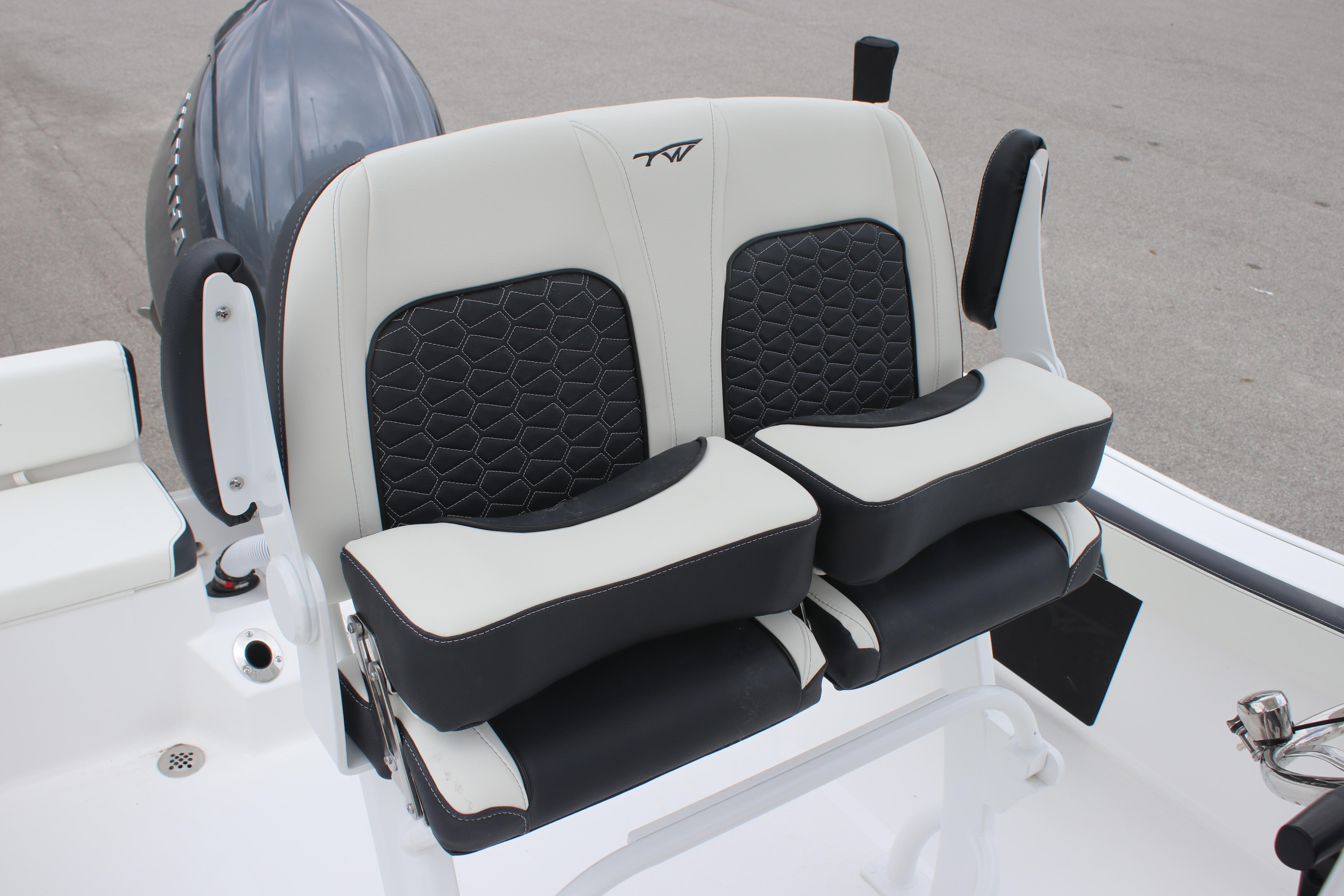 2026 Tidewater 198 CC Adventure boat seats with black and white cushioned design.