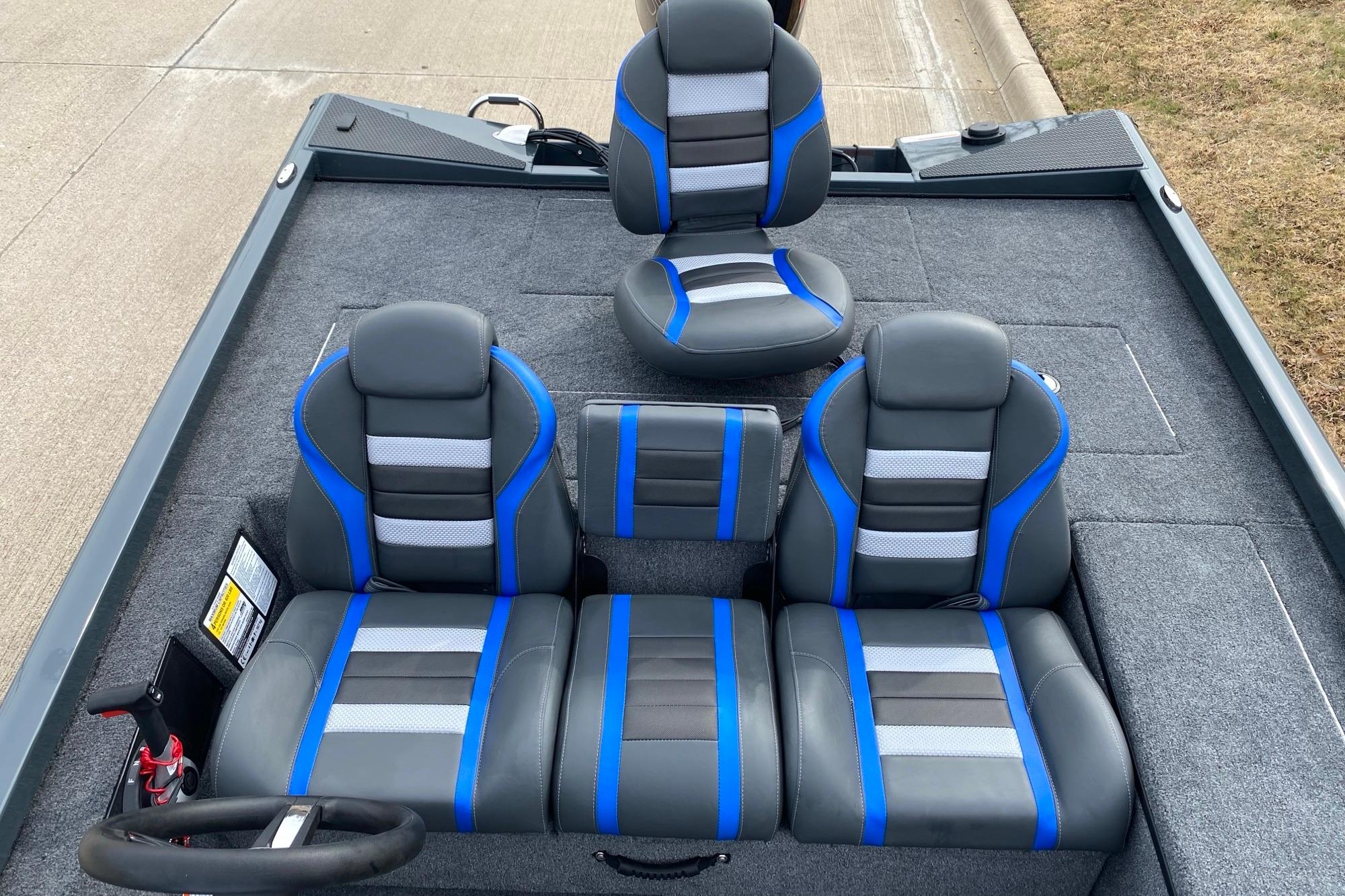 2026 Ranger RT188C boat interior with gray and blue seating on a carpeted deck.