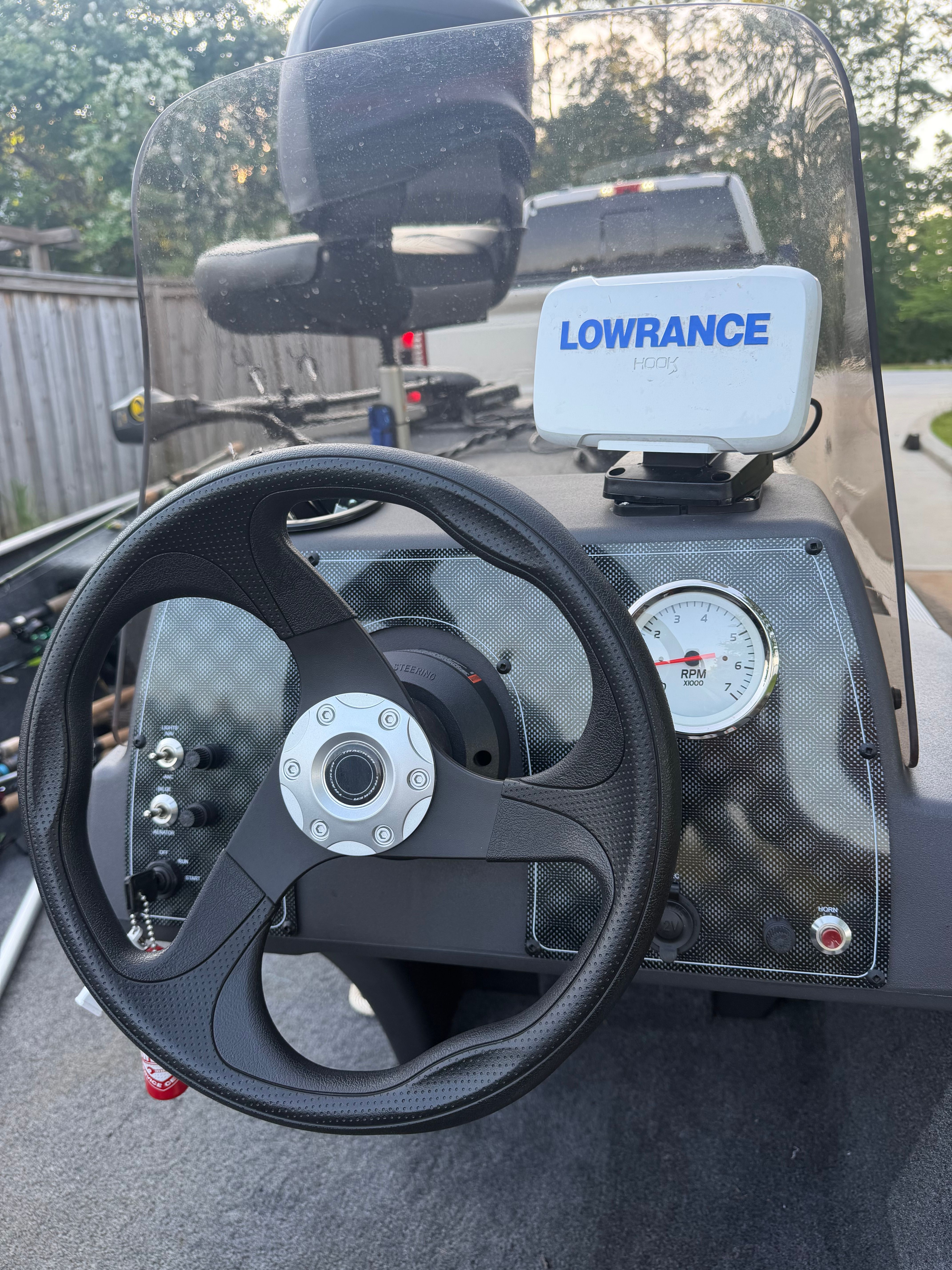 The image shows the helm of a Bass Tracker Classic XL boat with a Lowrance HDS-5 device.