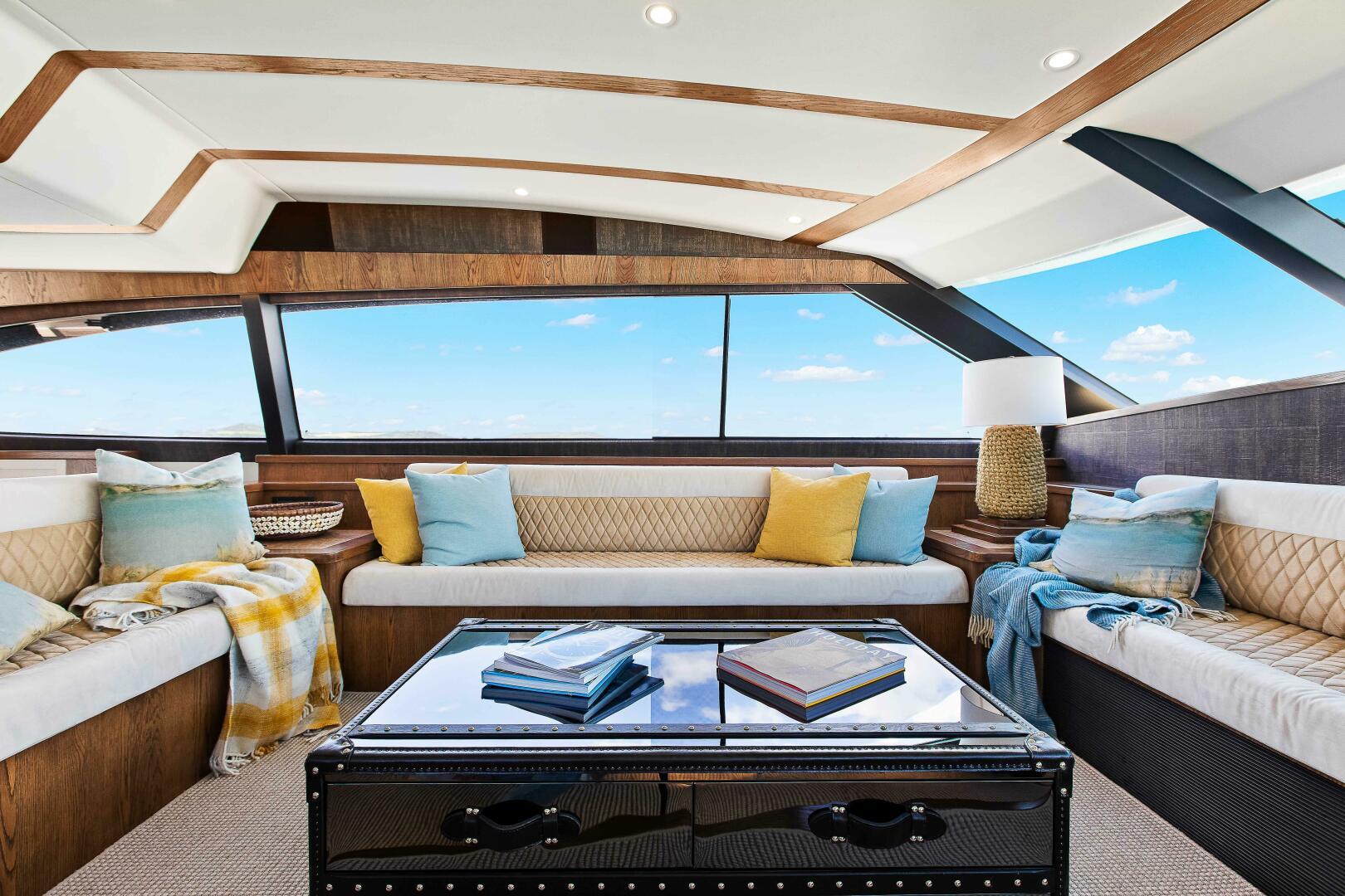 Luxurious interior of 2021 Valder Yachts Powercat with plush seating and panoramic windows.