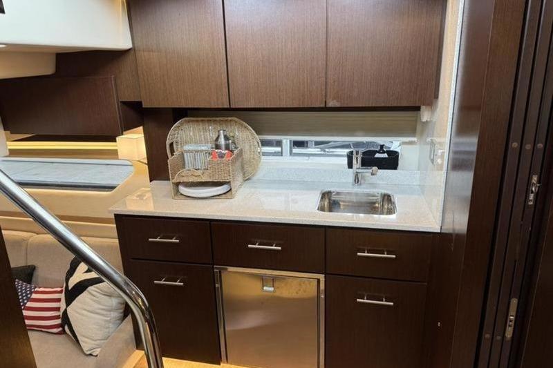 Luxurious kitchen area in a 2017 Regal 42 Grande Coupe yacht.