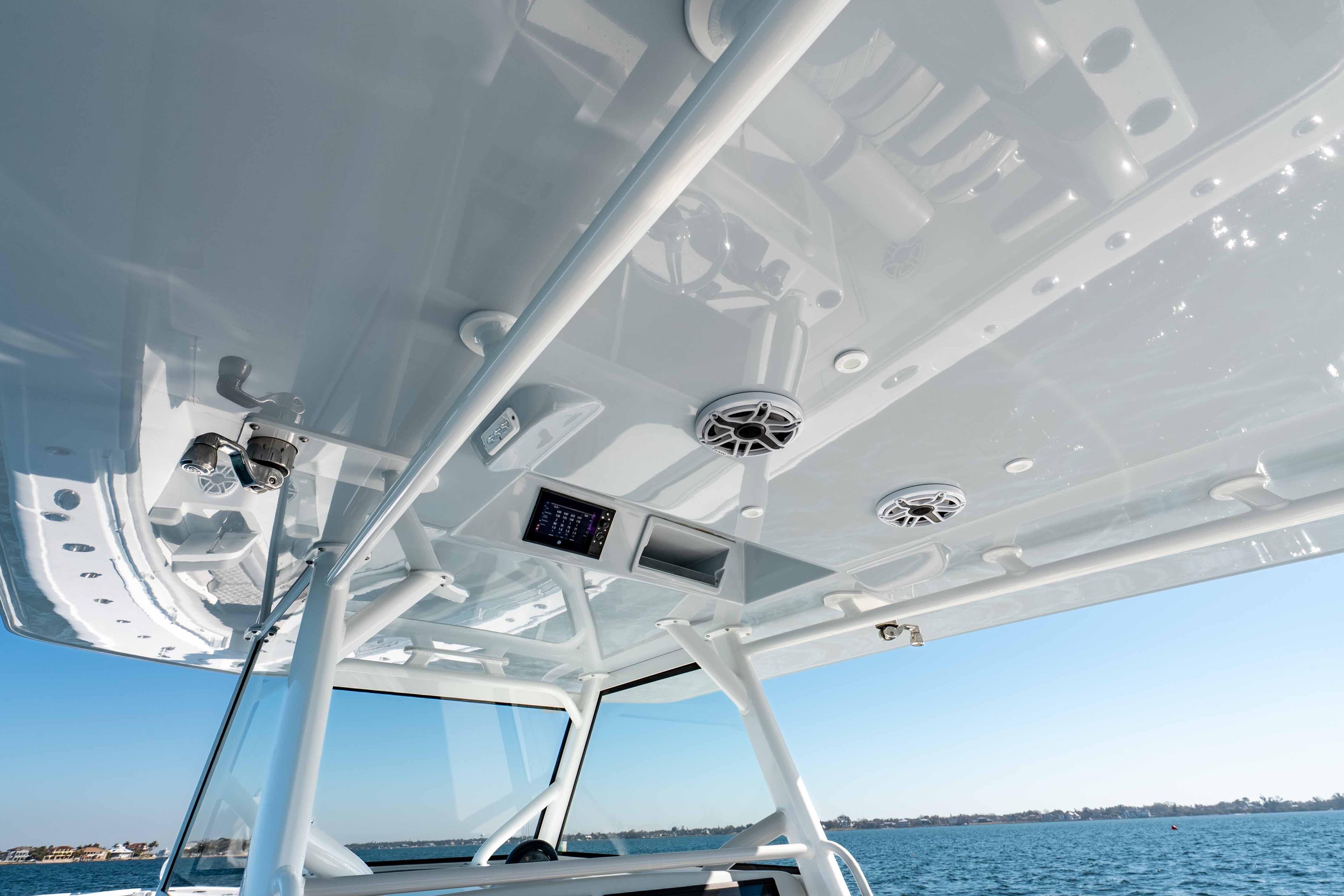 2023 Yellowfin 42 Offshore boat interior with speakers and control panel, ocean view.