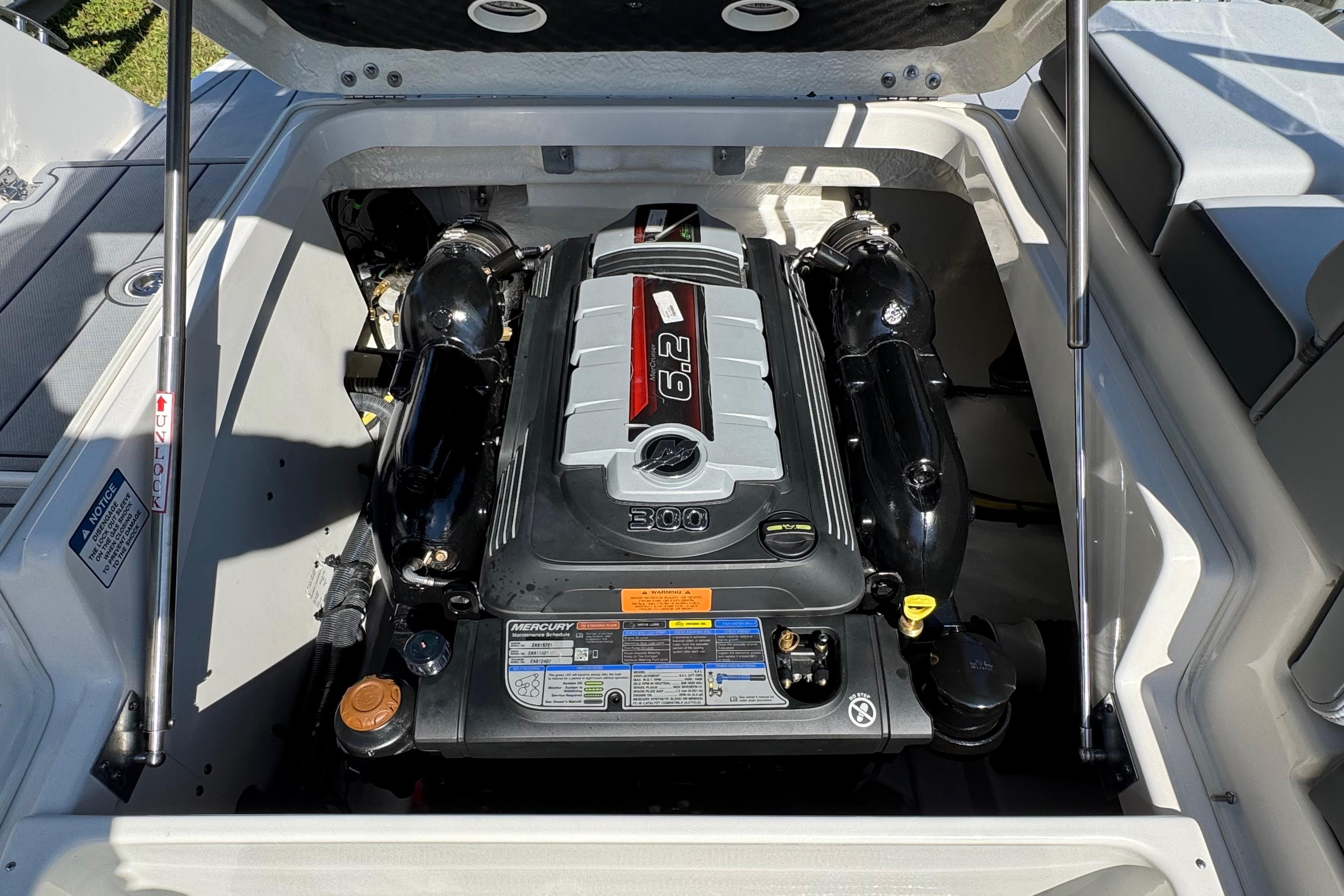 Engine compartment of 2026 Chaparral SSX 4 boat, featuring a powerful Mercury 6.2L engine.